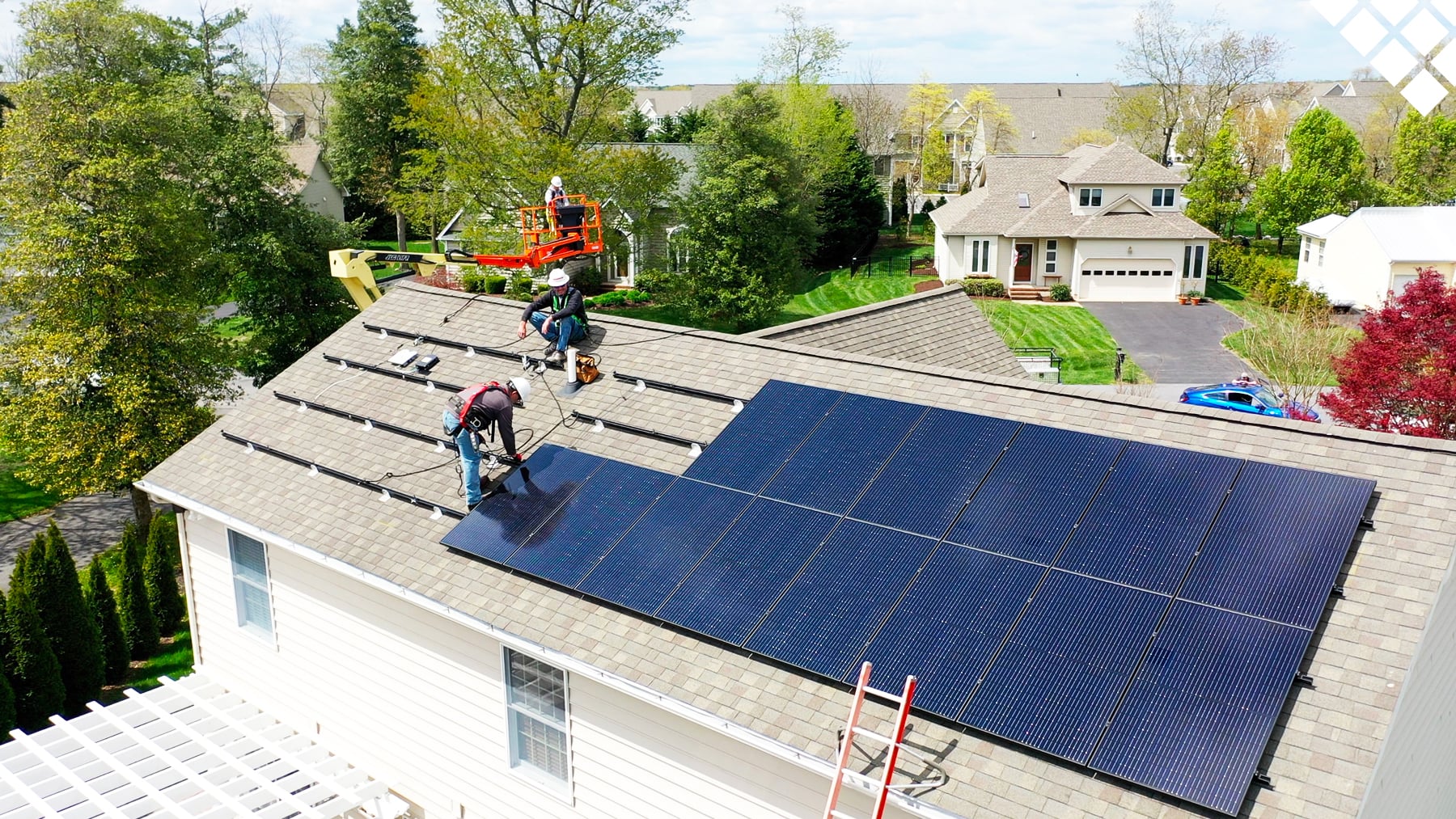 Solar Dave installation crew mounting solar panels on a Massachusetts home