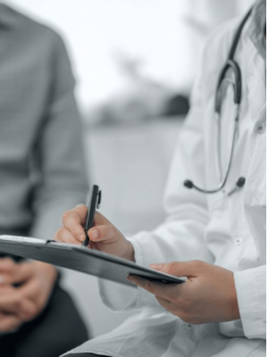 GP at One8Clinic in Melrose Arch consulting with a patient and making medical notes during a general health appointment