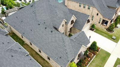 Precision roofing installation with high-quality shingles and proper drainage. 