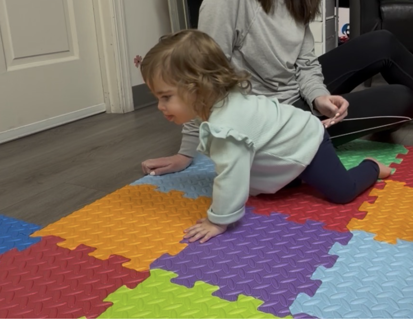baby crawling on floor in pediatric physical therapy in Scottsdale, AZ