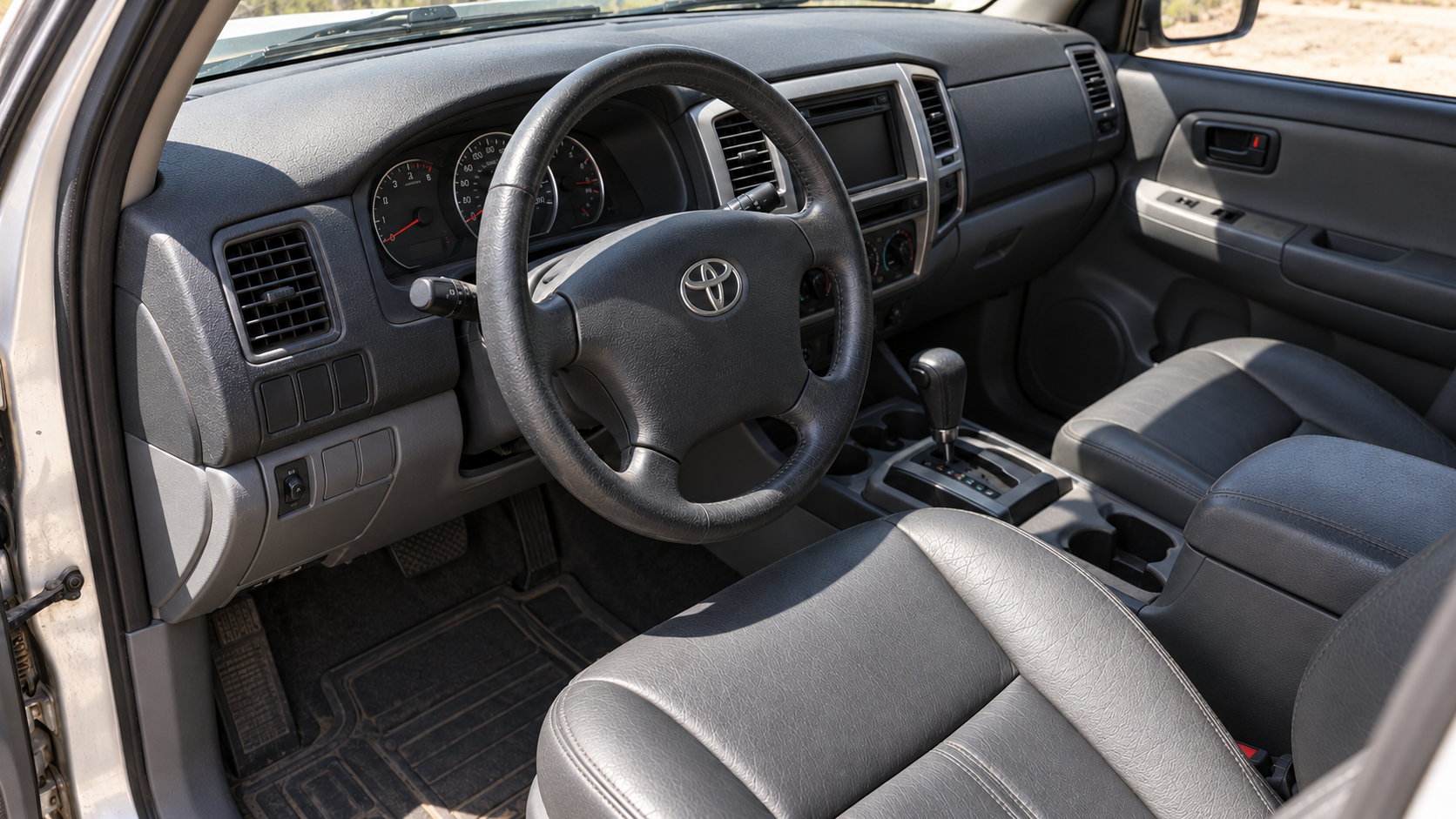 After: the same dash and seat cleaned, conditioned and ceramic coated
