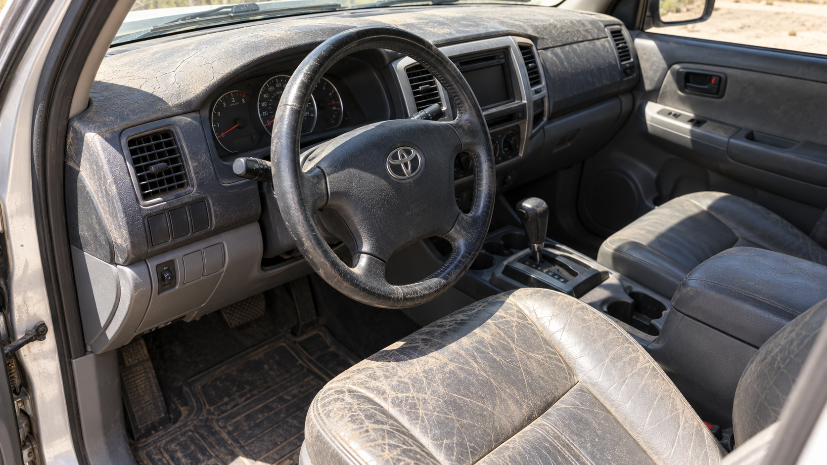 Before: sun-faded cracked dash and dried-out seat bolster