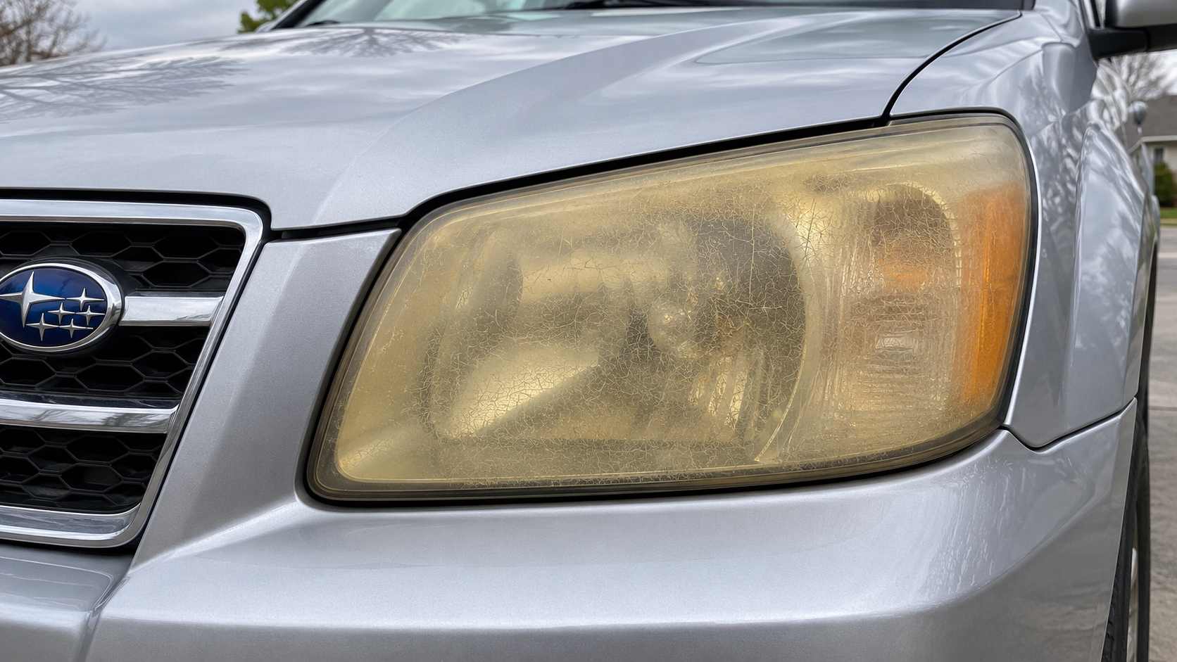 Before: clouded and yellowed headlight lens