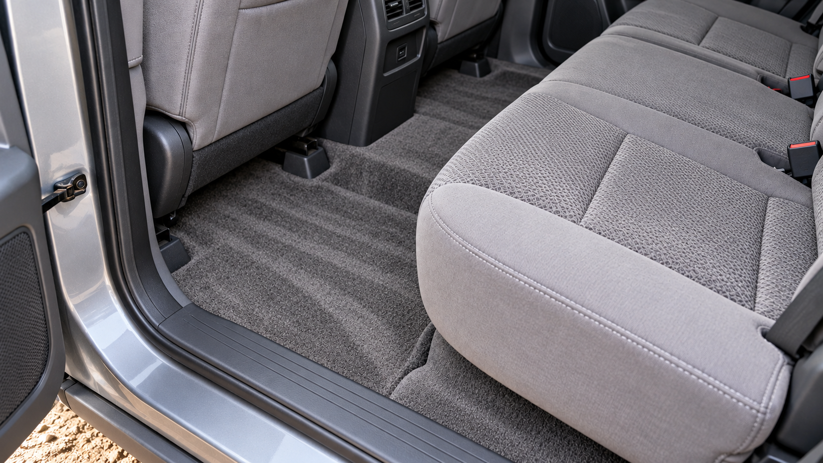 After: the same footwell extracted, with vacuum lines in the carpet