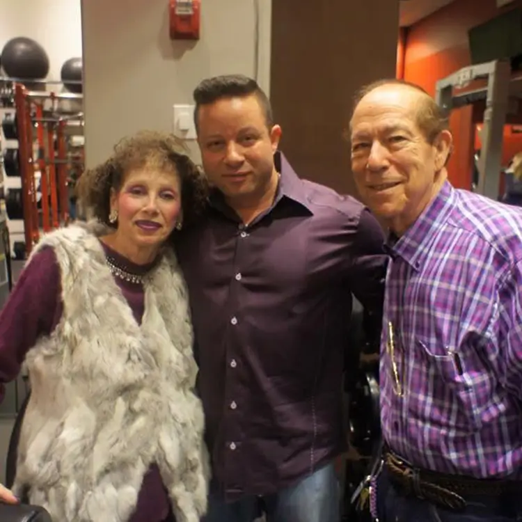 Jamie Mushlin the owner of Red fitness lounge with his parents