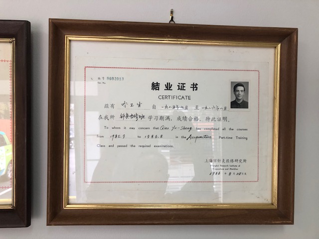 1986 completion certificate in acupuncture from the Shanghai Research Institute of Acupuncture and Meridian