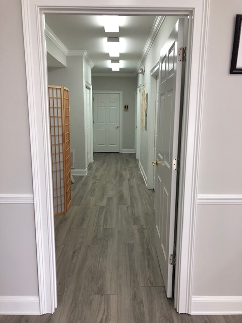 Hallway view of Shanghai Acupuncture Clinic showing the entry to multiple treatment rooms