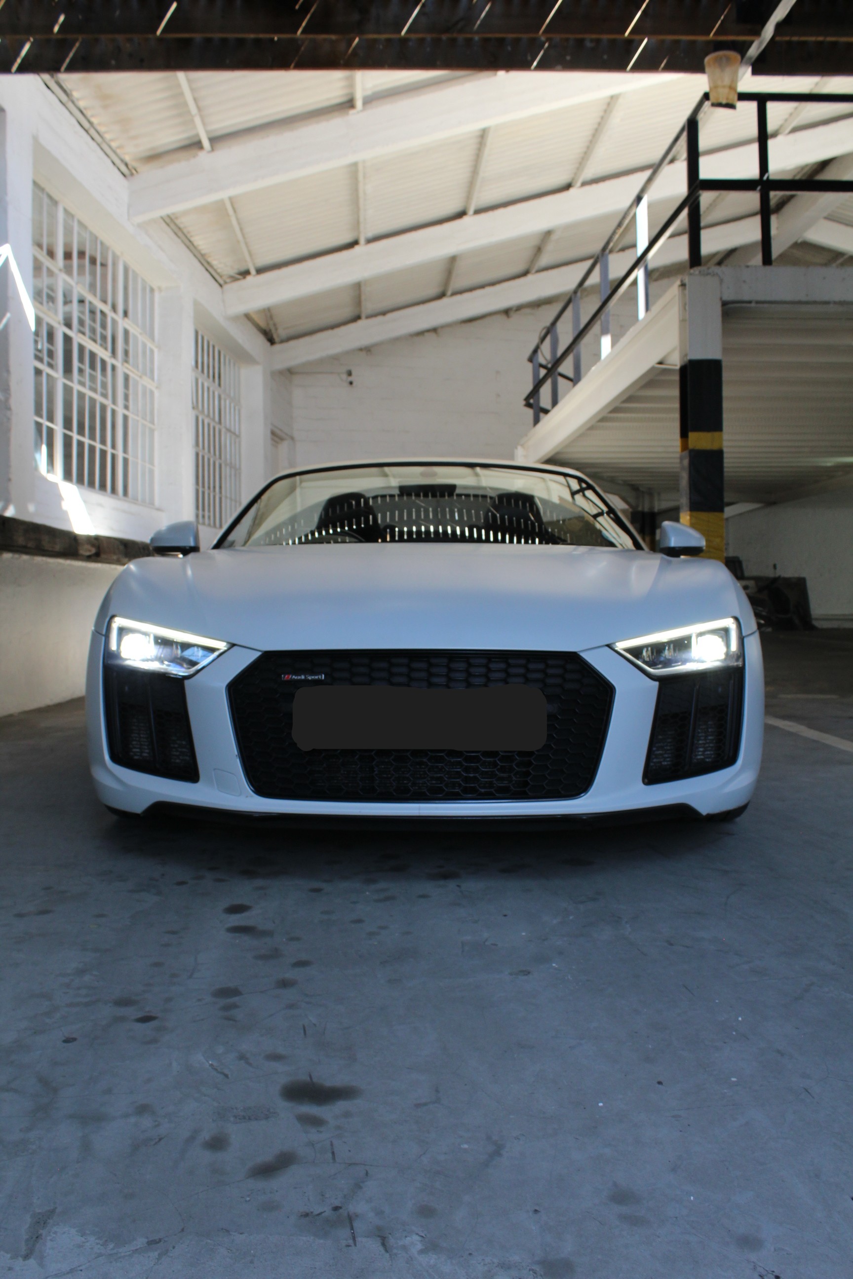 White 2019 Audi R8 Spyder V10 Convertible side view.