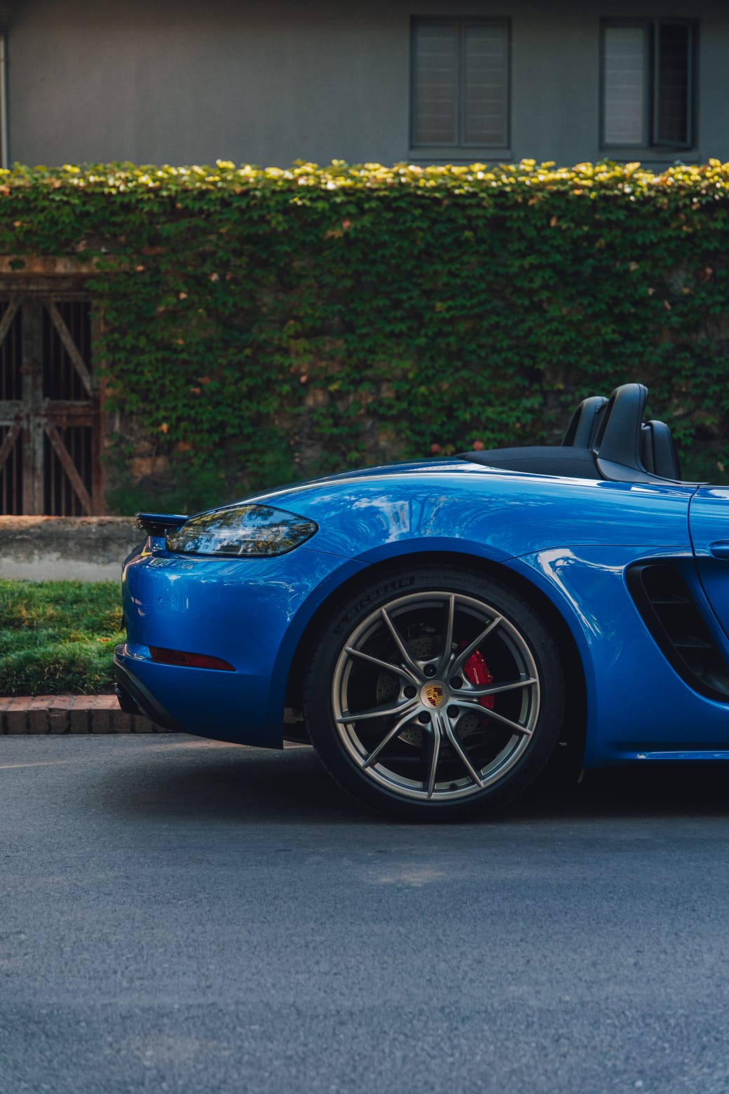 Front-side parked view of the blue 2017 Porsche Boxster 718 S.