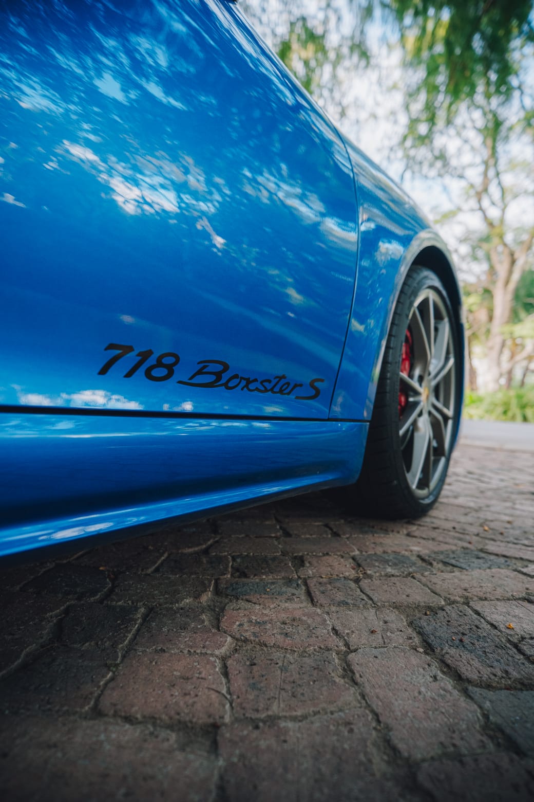 Close-up of the 718 Boxster S side decal and wheel detail.