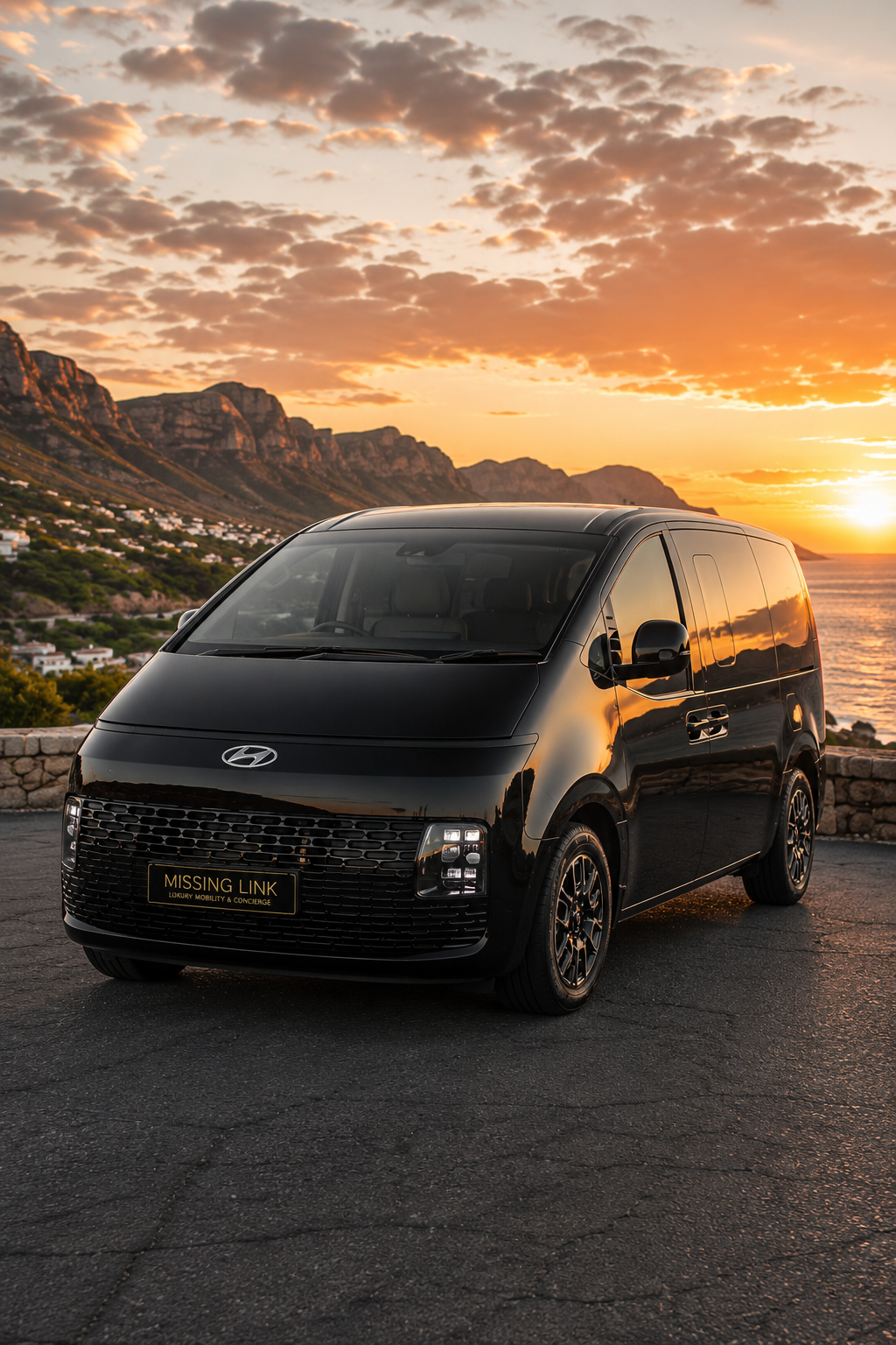 Front three-quarter view of the black 2026 Hyundai Staria