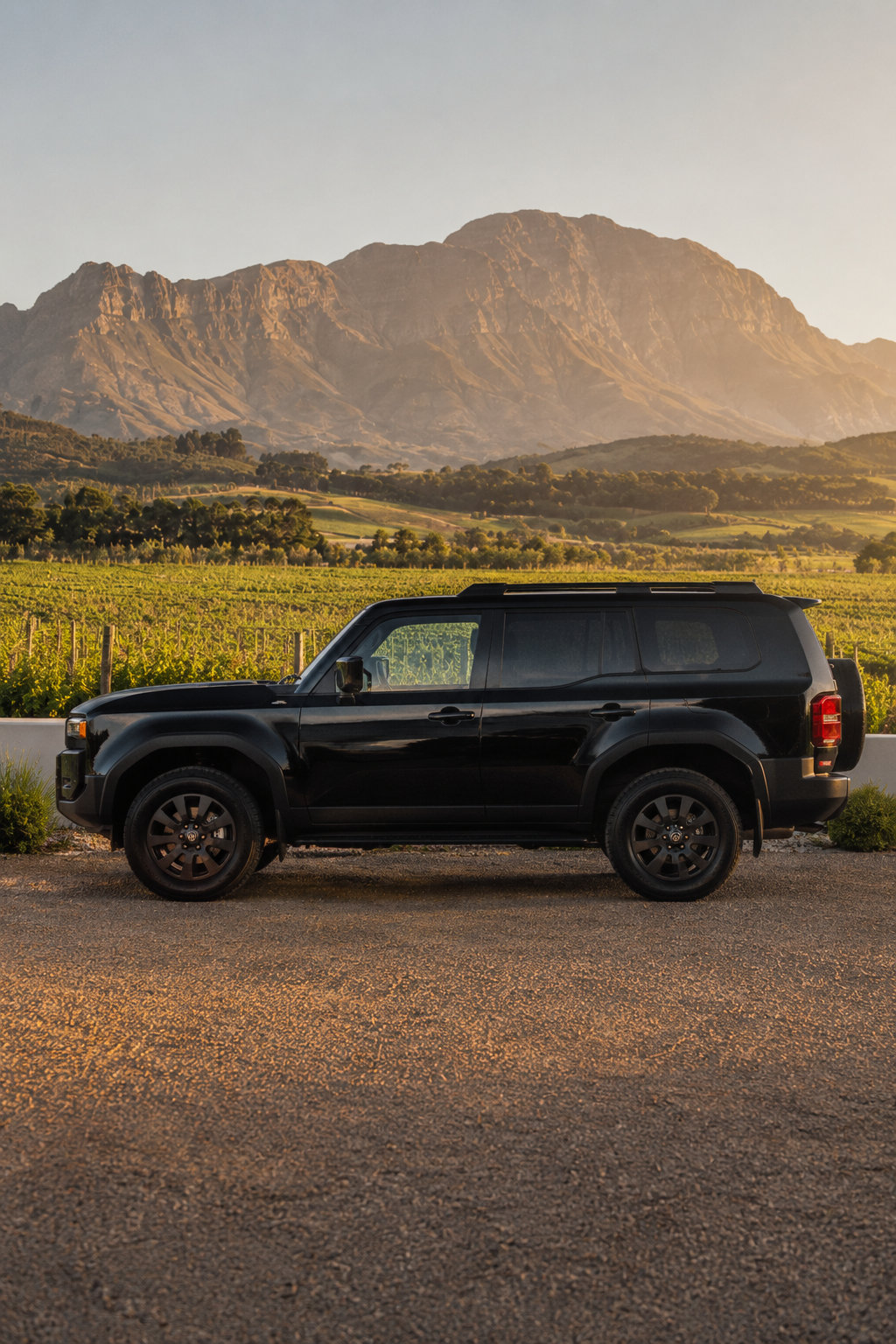Side profile of the black 2025 Toyota Land Cruiser Prado VXR 7 Seater