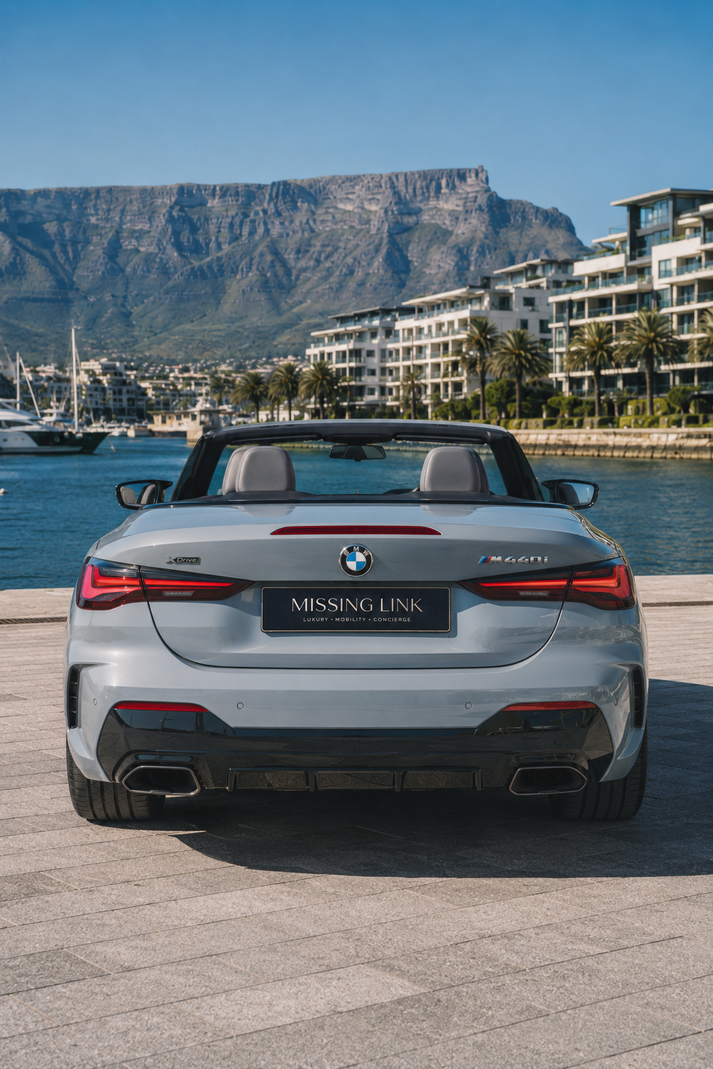 Rear view of the grey 2024 BMW M440i xDrive