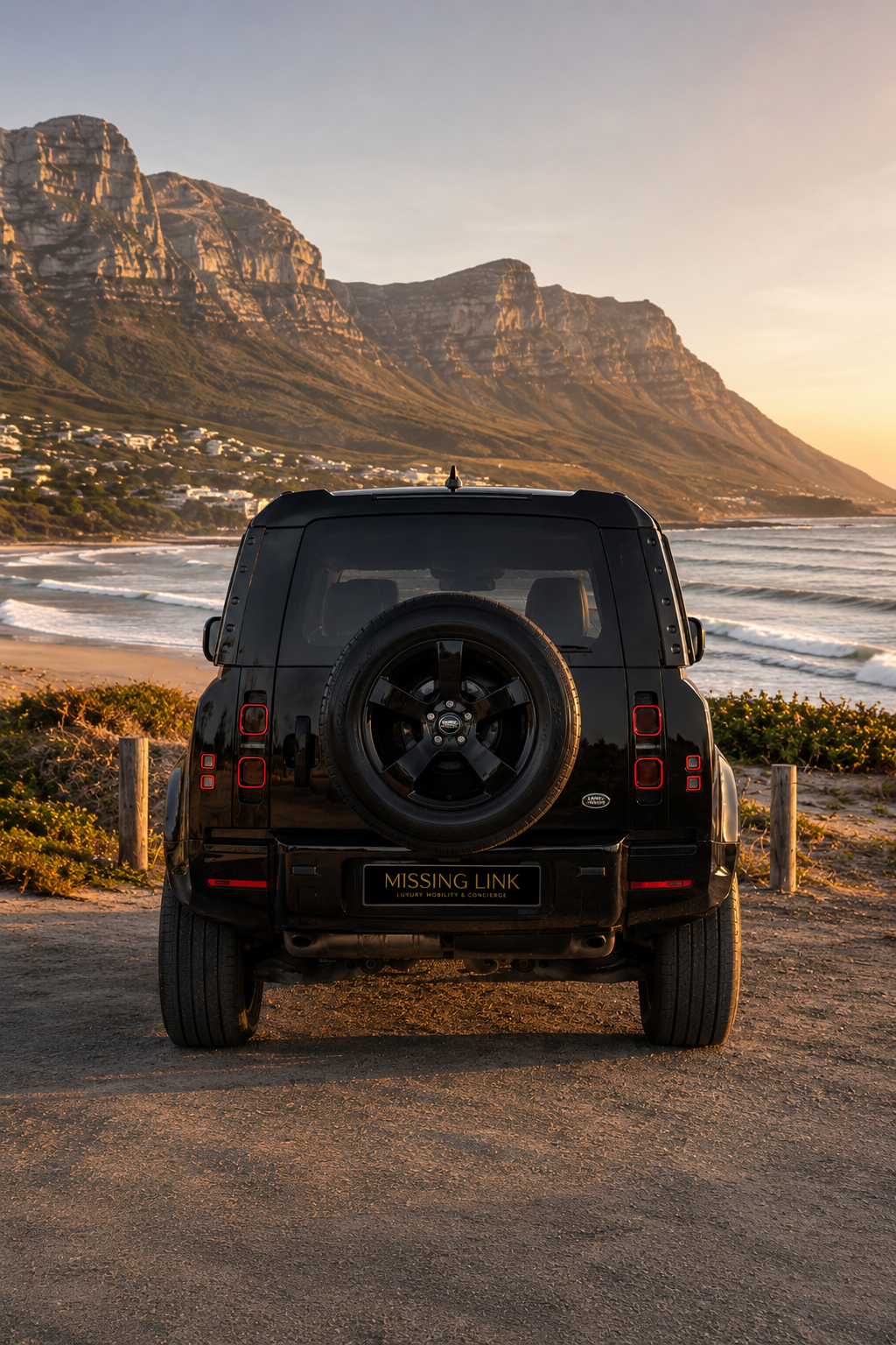 Rear view of the black 2022 Land Rover Defender D300