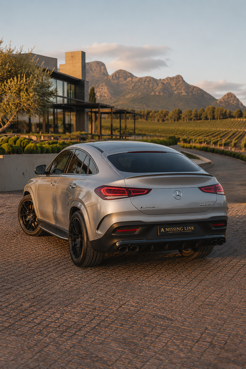 Rear three-quarter view of the silver 2021 Mercedes Benz GLE 53