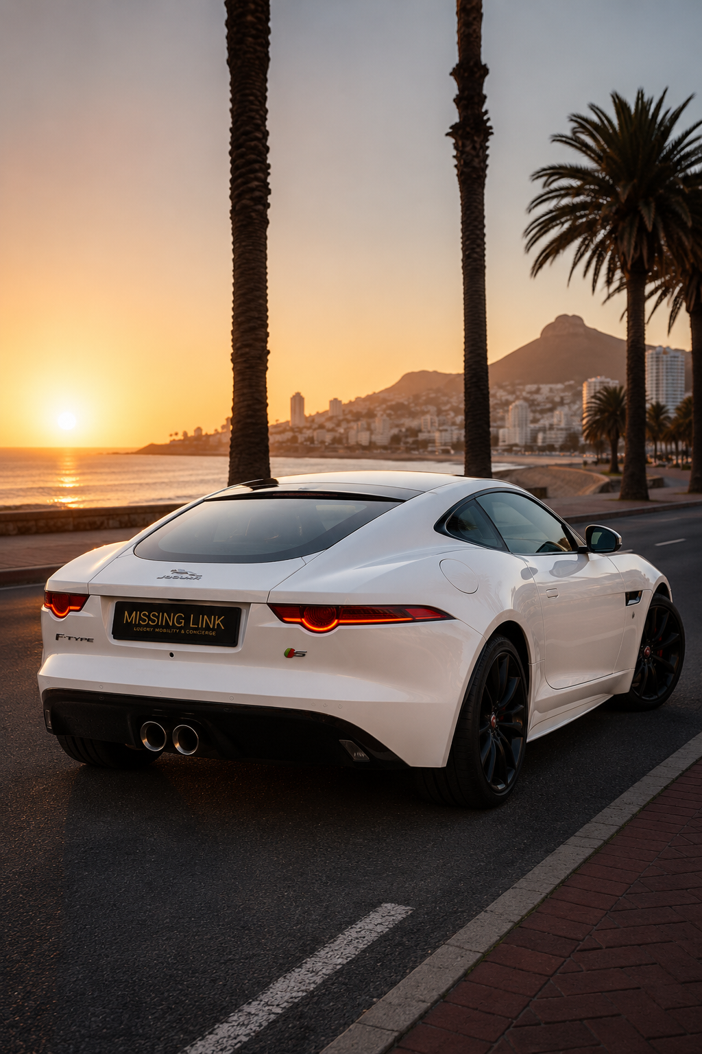 Rear side angle view of the white 2017 Jaguar F-Type V6 Hardtop