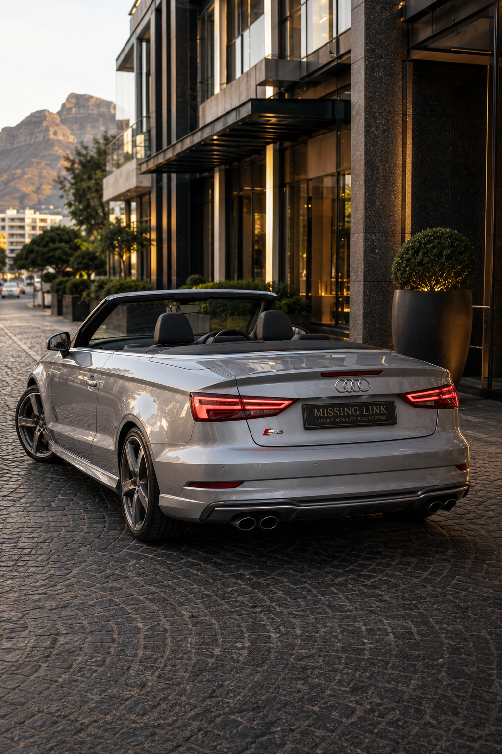 Rear three-quarter view of the silver 2017 Audi S3
