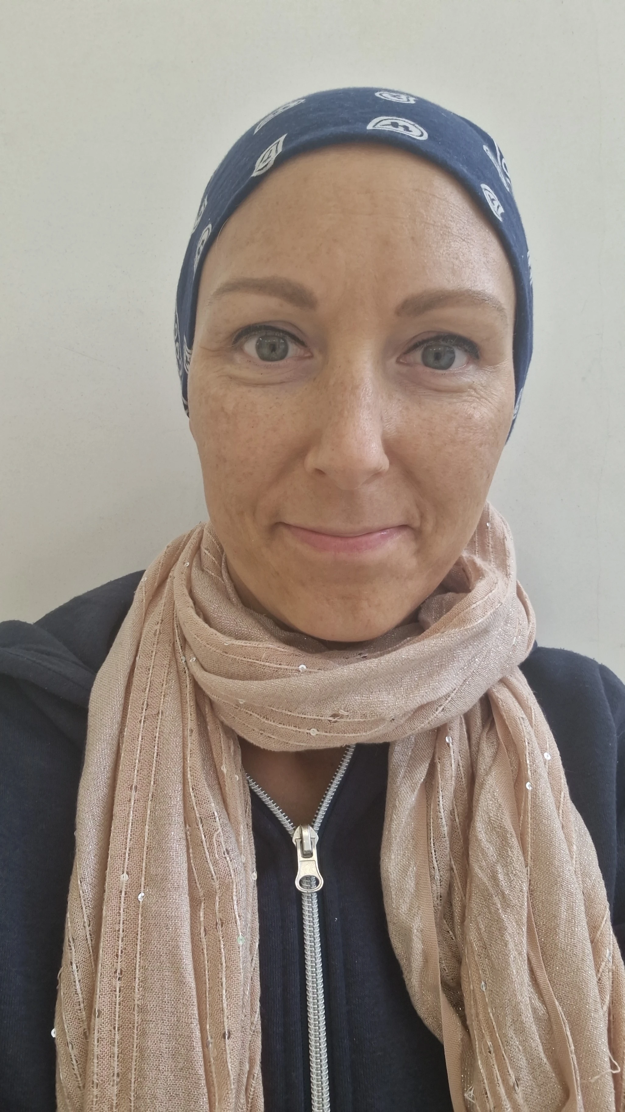 Veronika wearing headscarf after getting discharged from the hospital for operation.