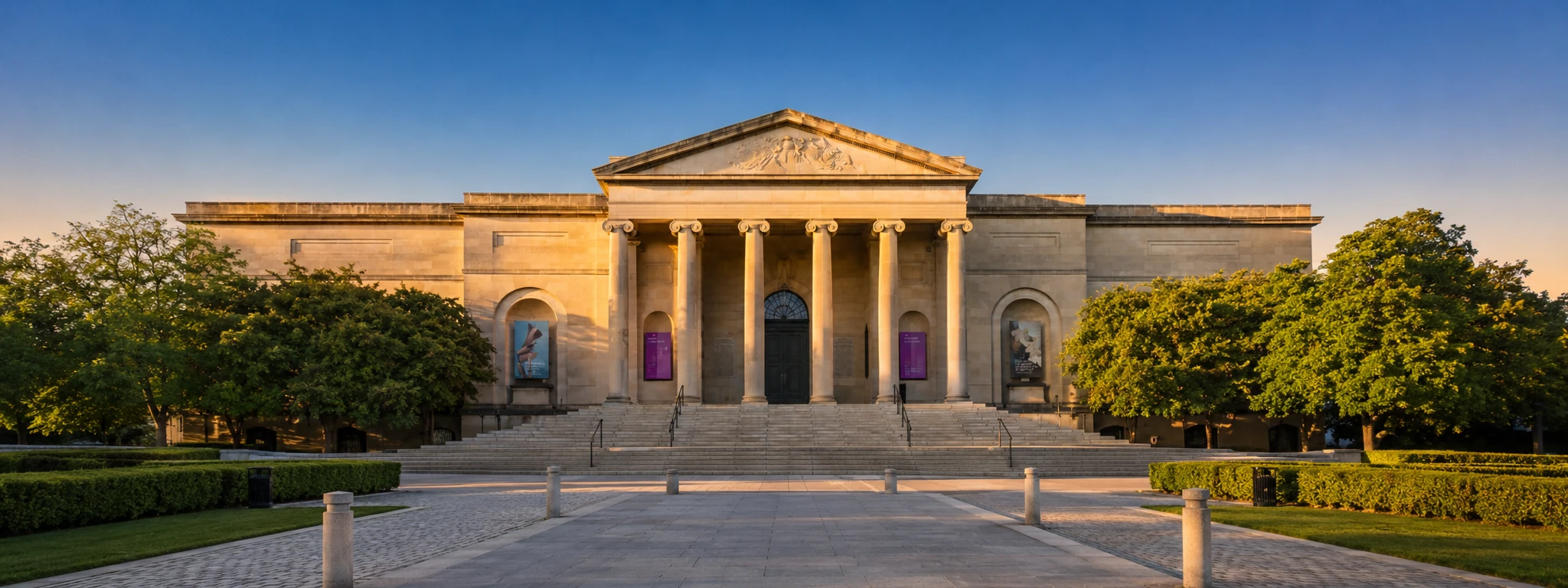 Baltimore Museum of Art entrance in Baltimore, Maryland with neoclassical columns and landscaped walkway.