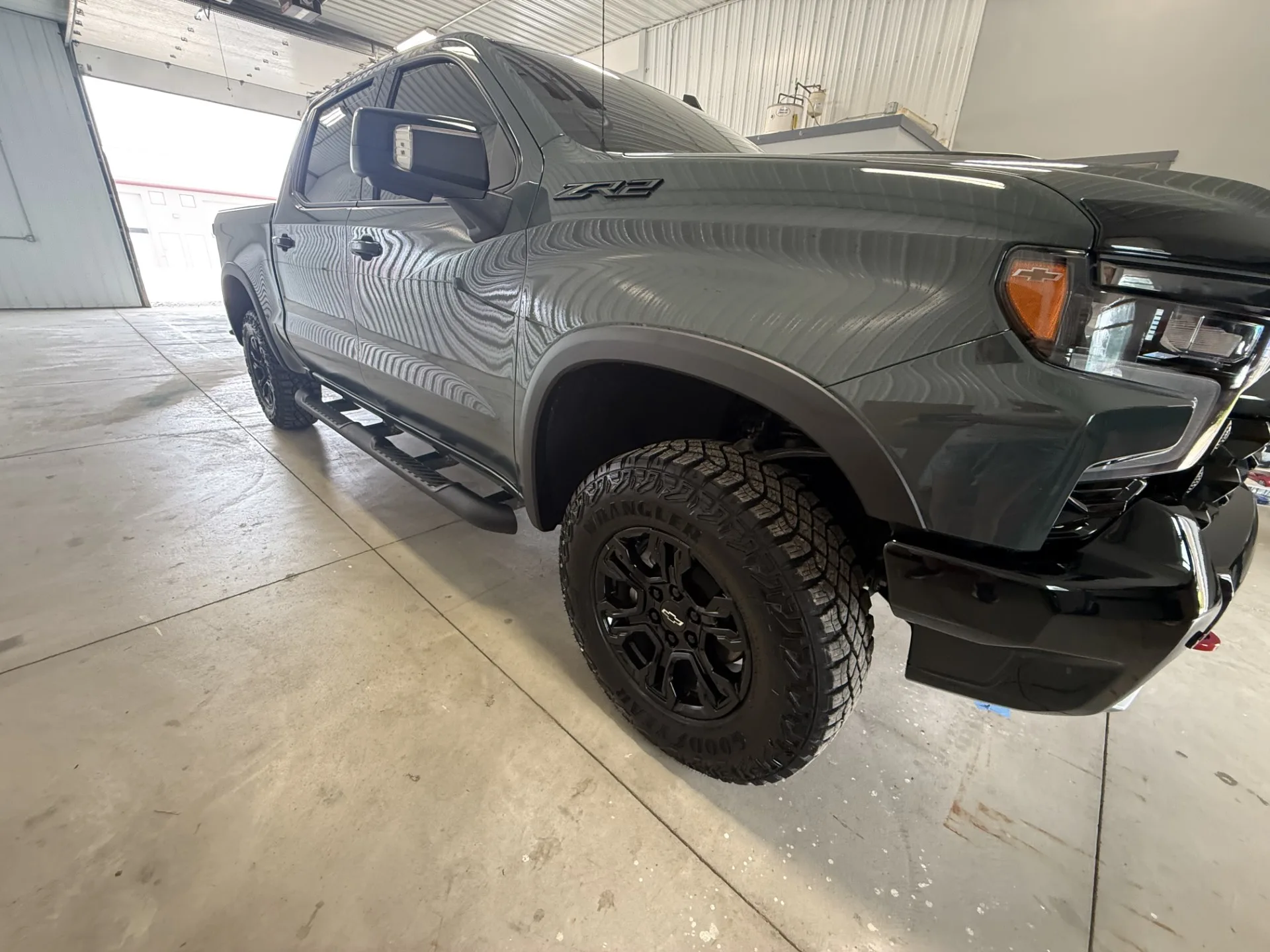 Finished gray pickup with clean exterior, wheels, and high-gloss paint