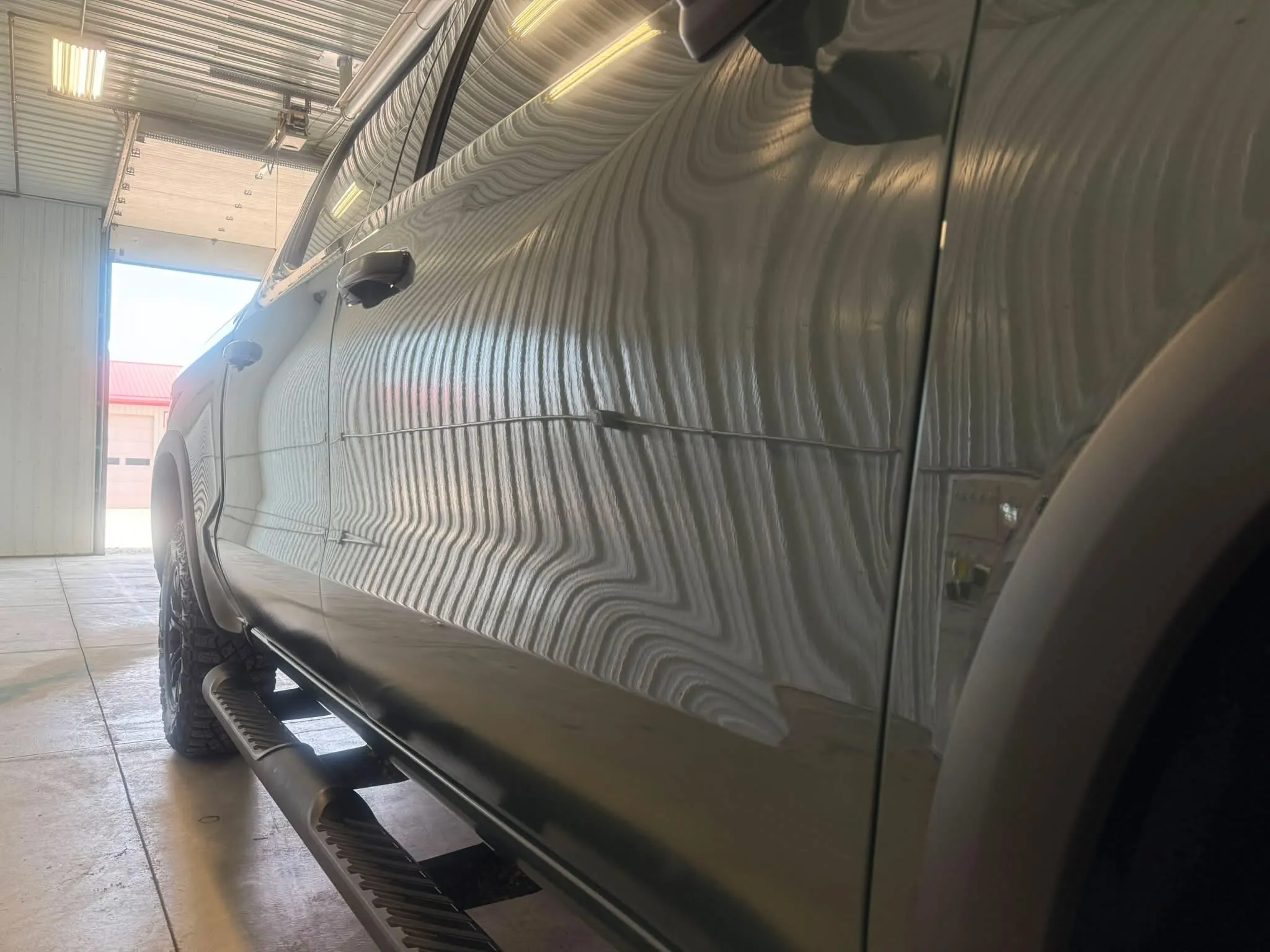 Deep restored paint reflections on a professionally detailed vehicle