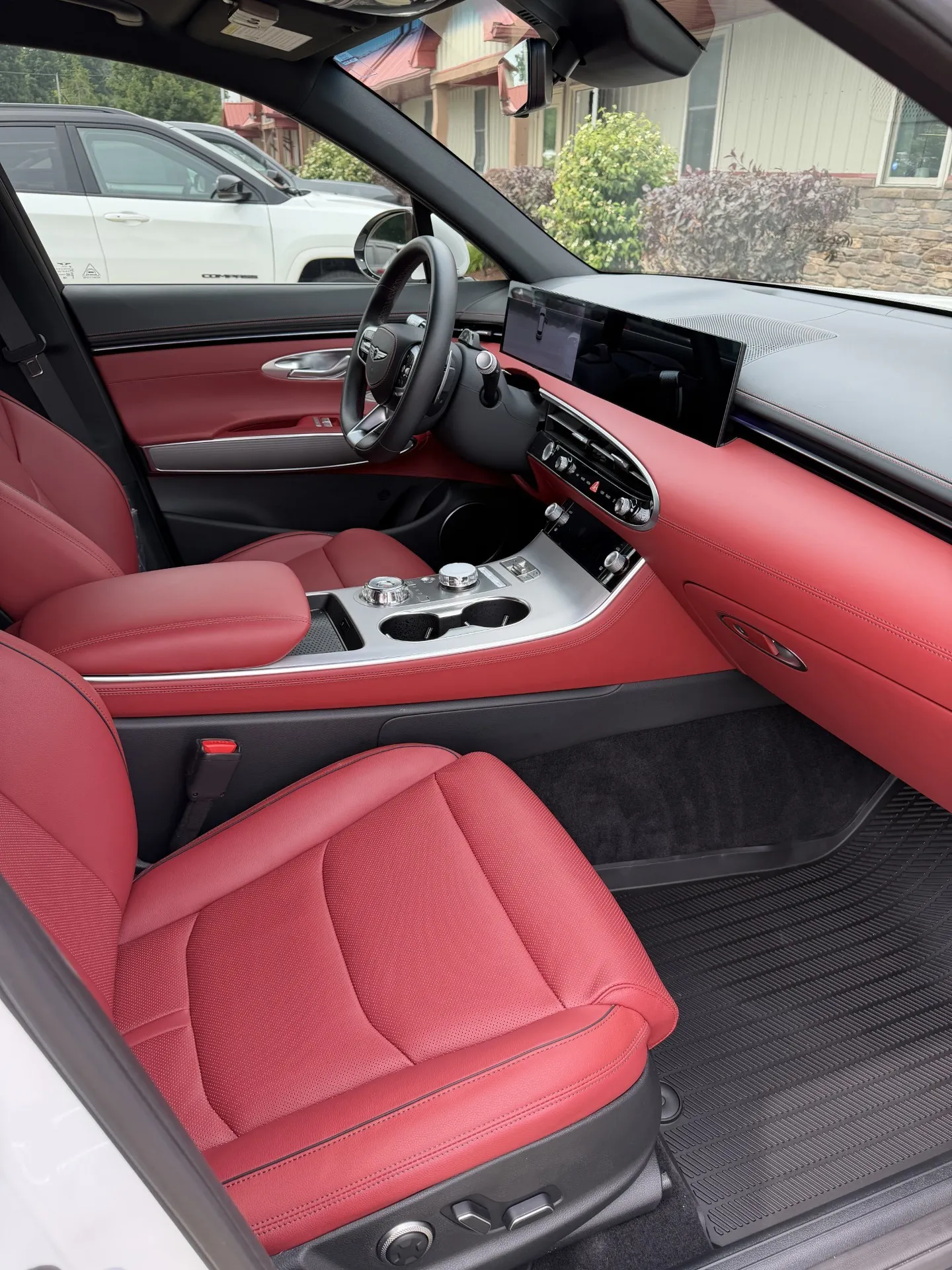 Clean red leather vehicle interior after professional interior detailing