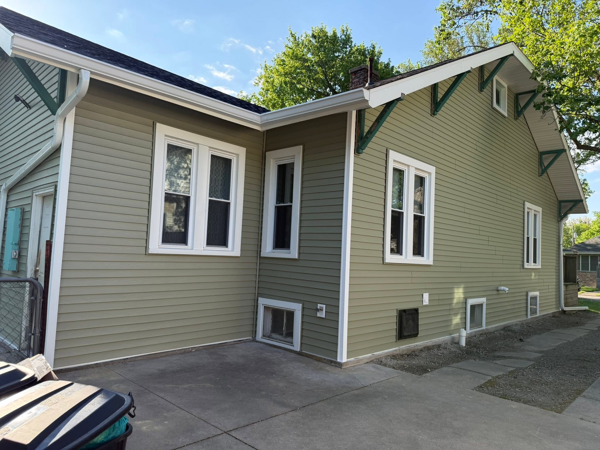 Sage vinyl siding on a home side elevation in Bloomington, Illinois