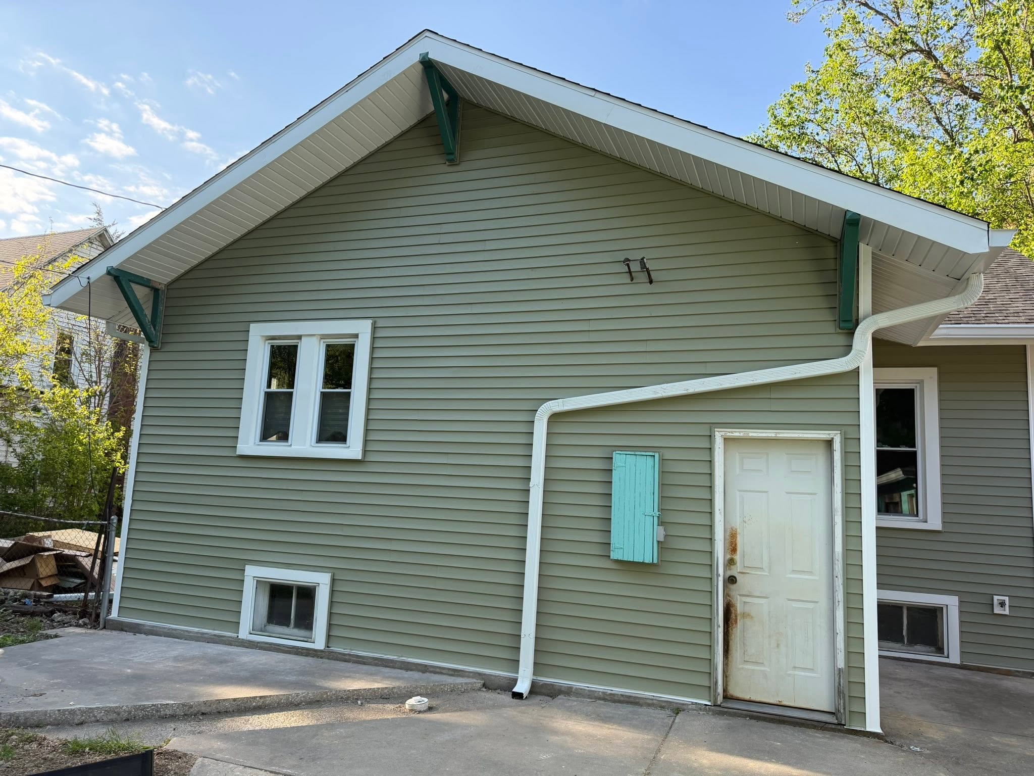 Rear gable with new siding and gutters in Normal, Illinois