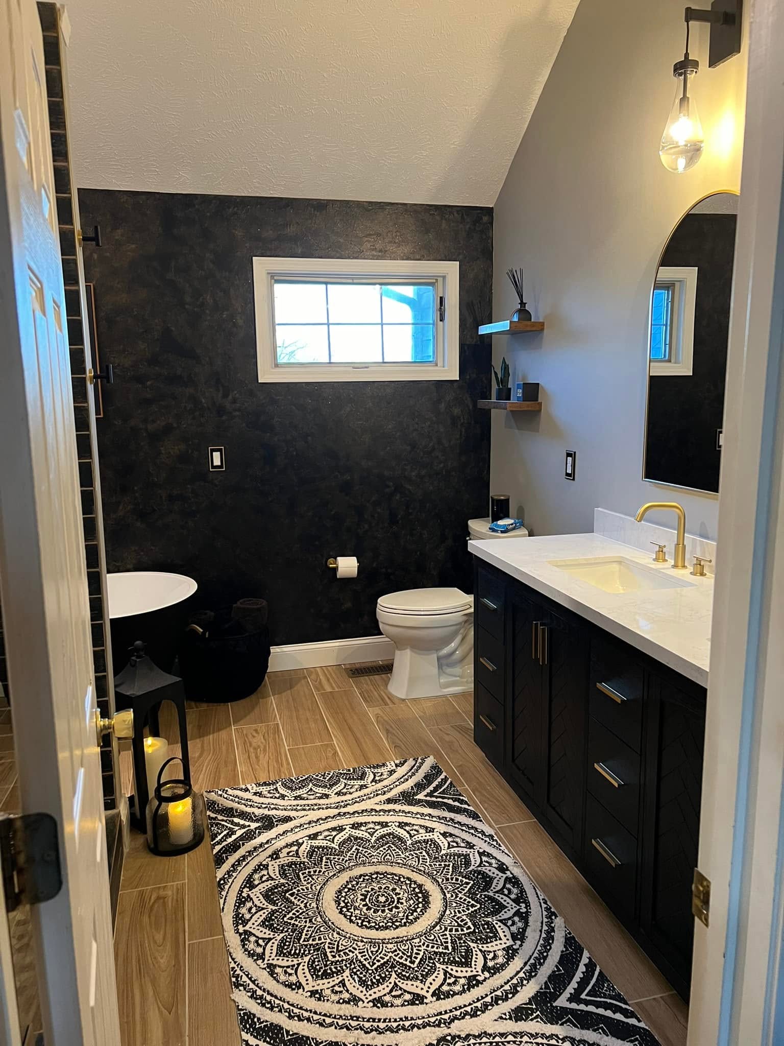 Wide view of a remodeled primary bathroom in Normal, Illinois