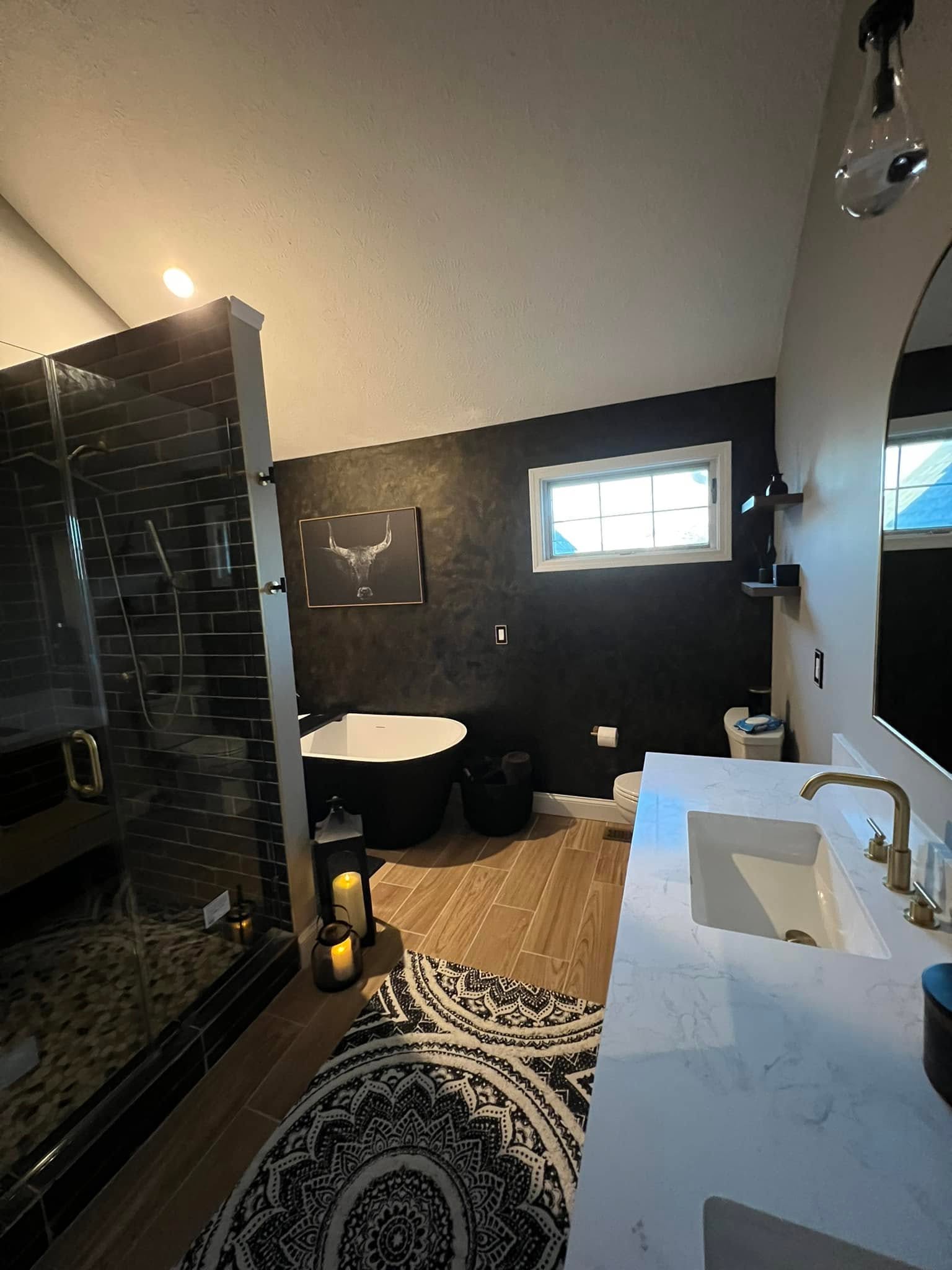 Glass shower, tub and double vanity in a Bloomington, Illinois bathroom remodel