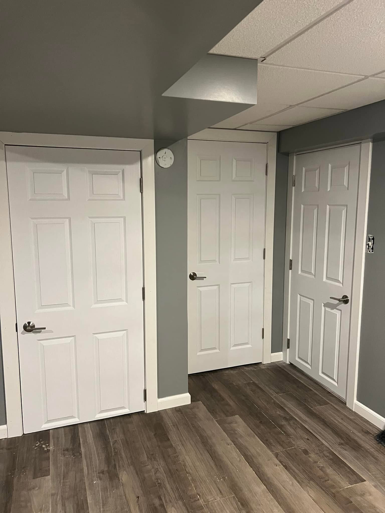 Gray wood look tile flooring installed in a Bloomington, Illinois basement