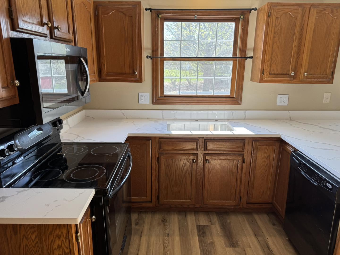 Kitchen remodel with quartz countertops and oak cabinets in Bloomington, Illinois