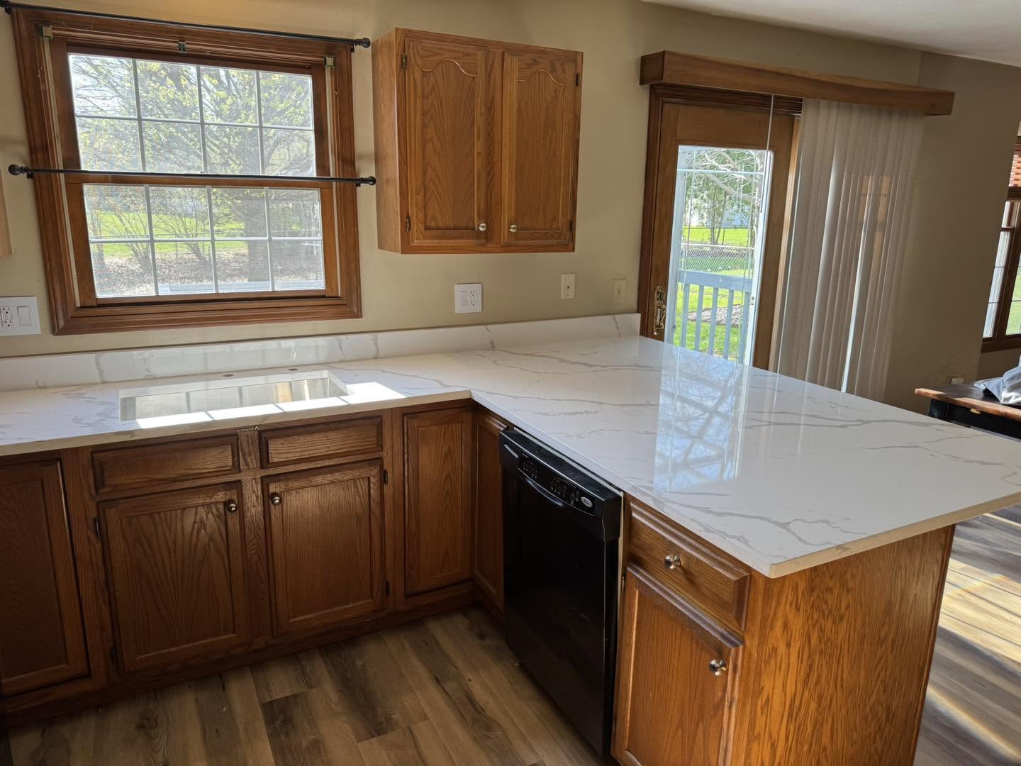 Kitchen remodel with quartz countertops and a peninsula in Normal, Illinois