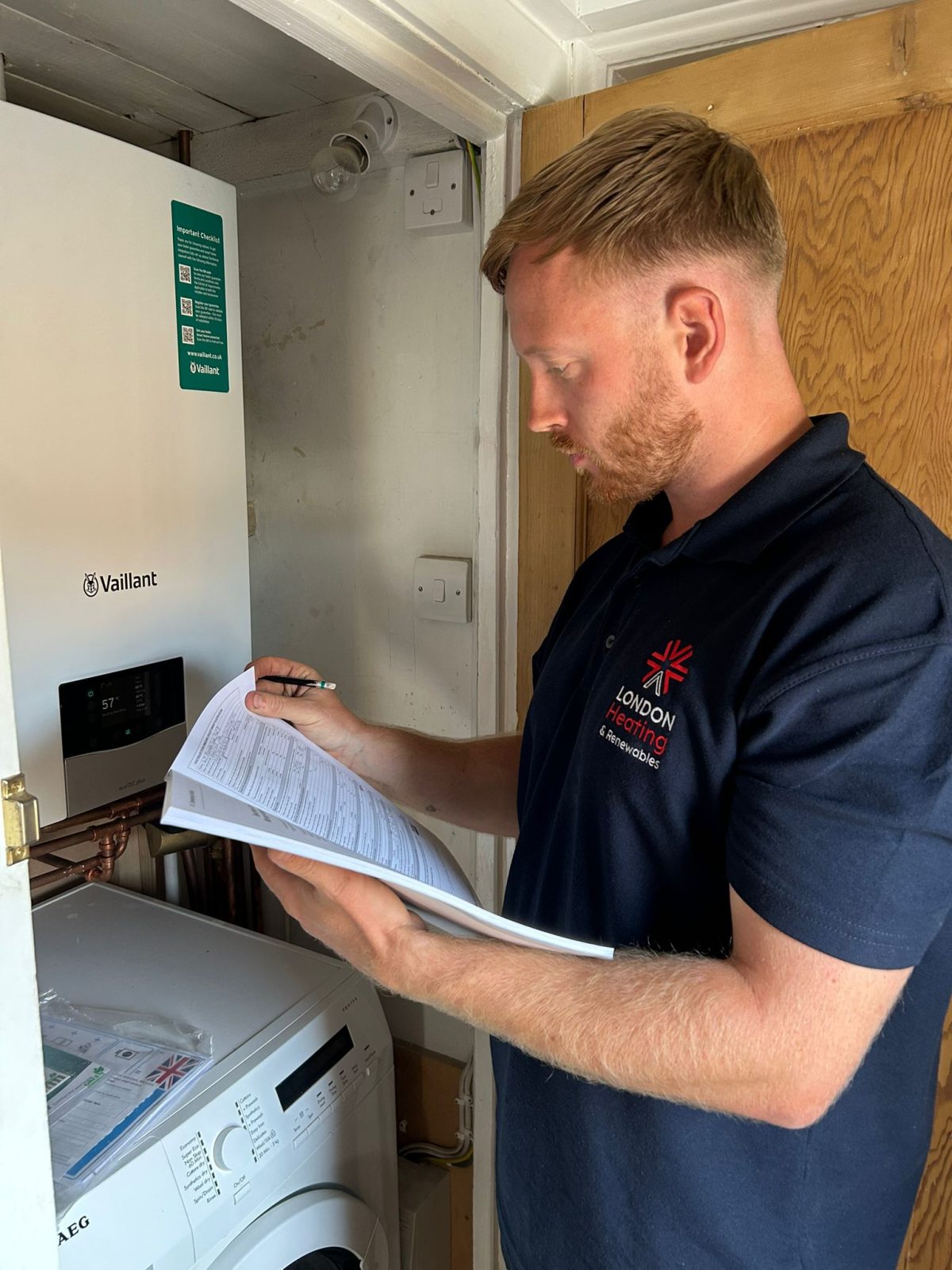 Ryan setting the controls on a newly installed boiler