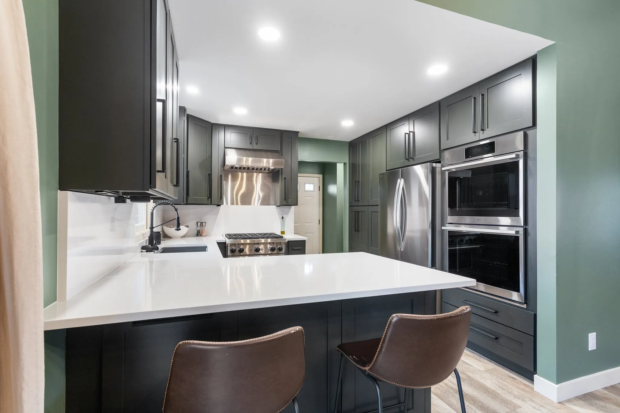 Modern kitchen with pendant lighting and island