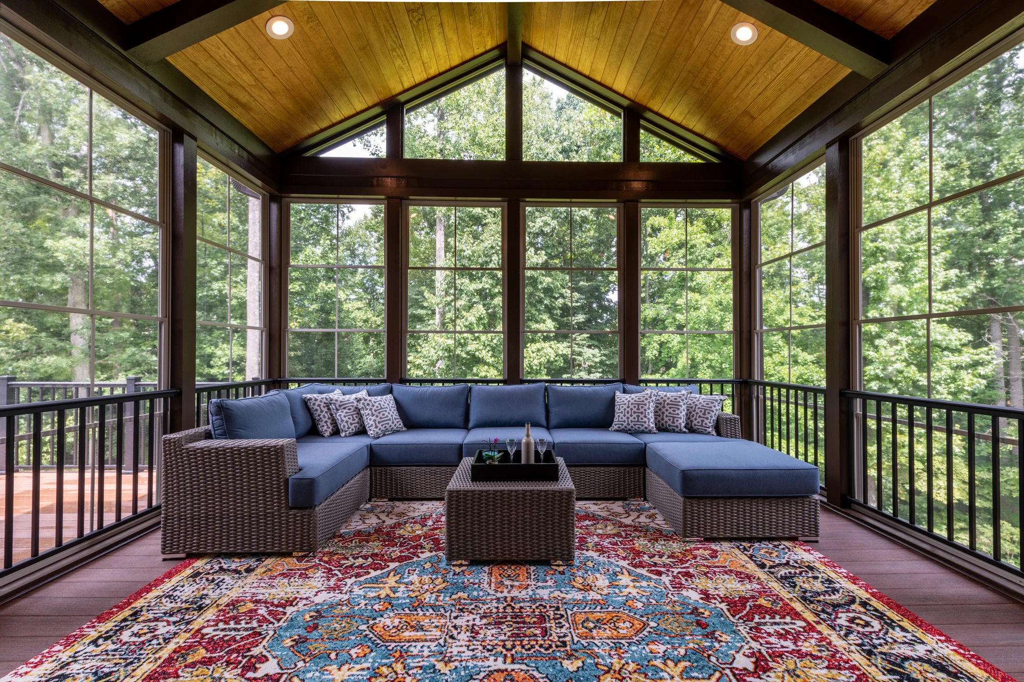 Four-season sunroom addition interior with vaulted wood ceiling by TPC Construction in Grand Rapids, MI