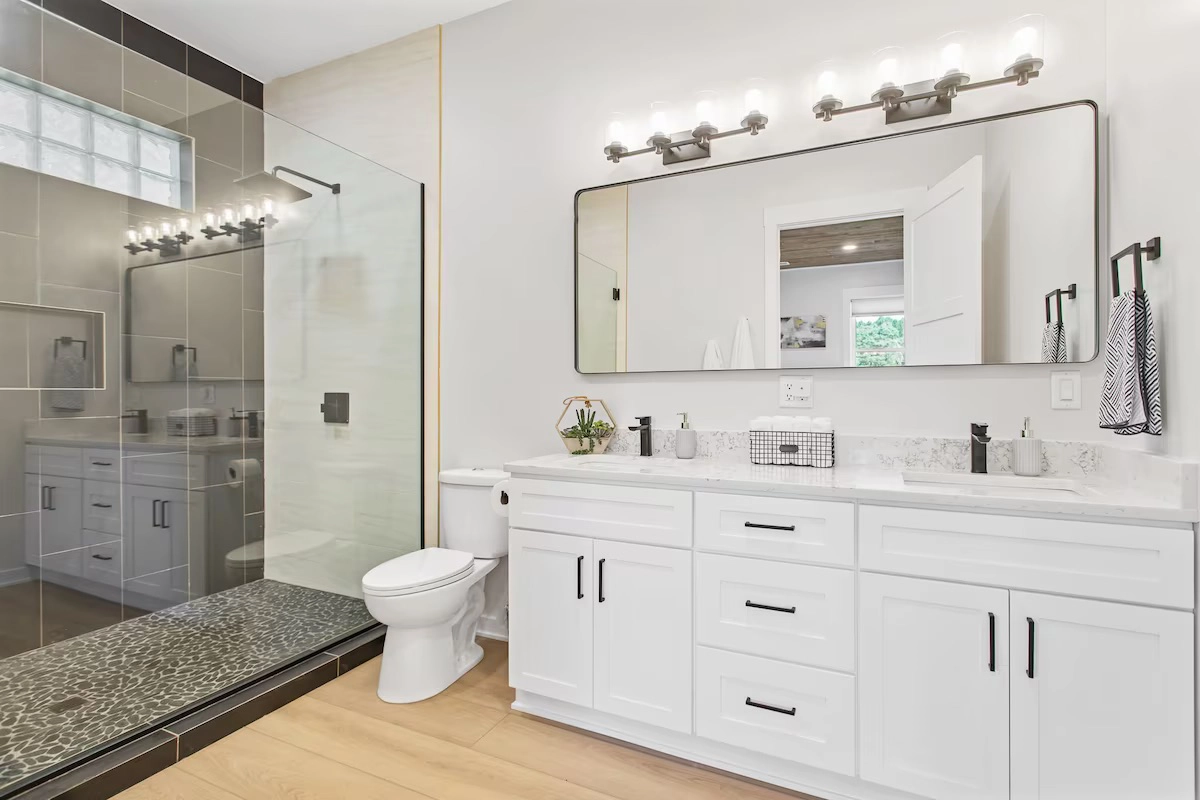 Modern bathroom with white vanity and glass shower