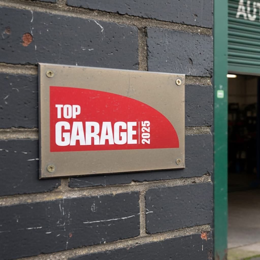 Top Garage 2025 plaque displayed at Shaw's Service Station