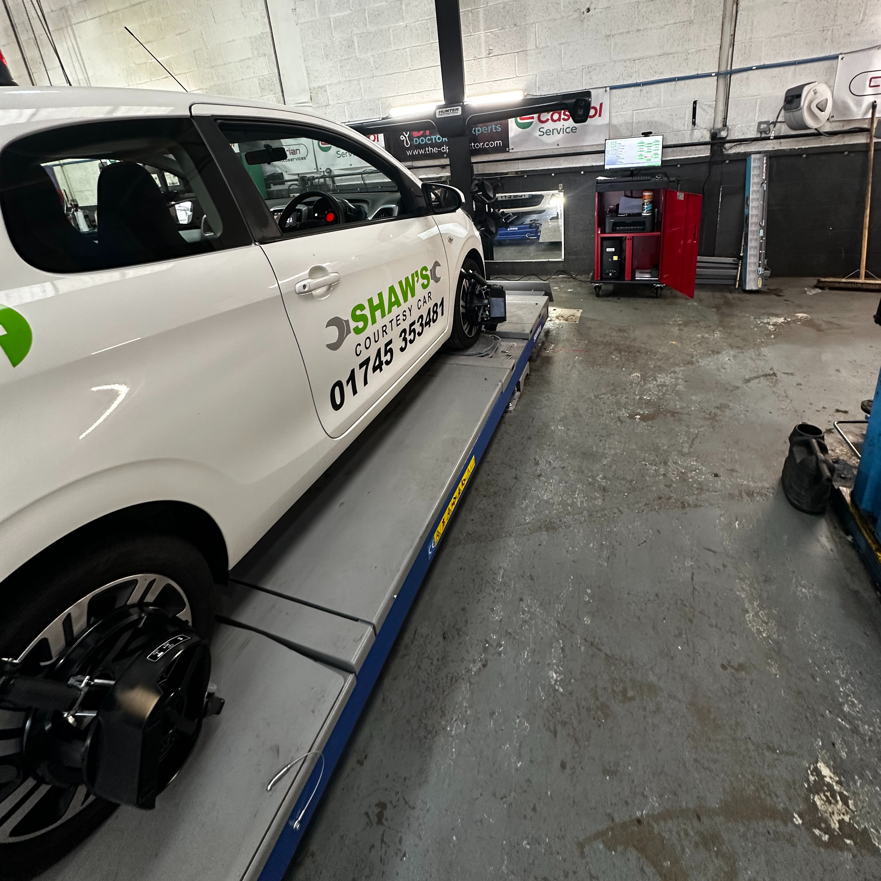 Vehicle on the Hunter four wheel alignment system at Shaw's Service Station