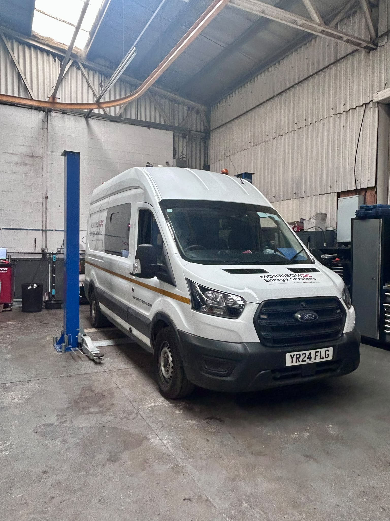 Commercial van in Shaw's Service Station workshop for servicing and inspection