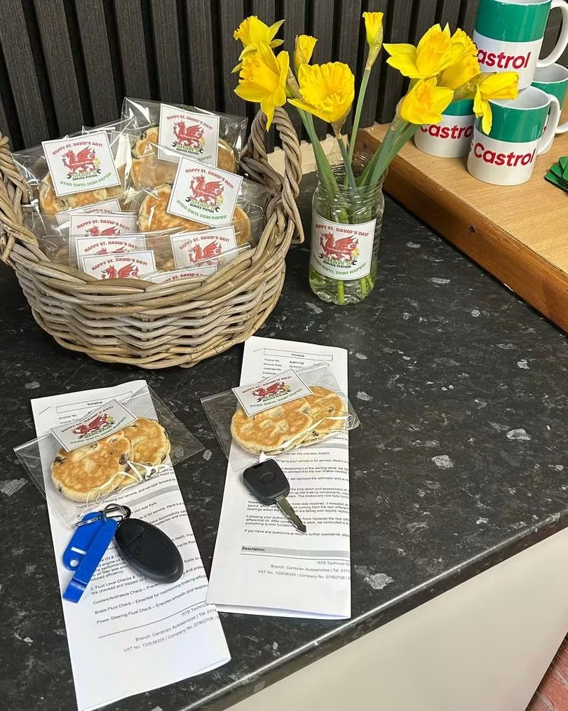Shaw's Service Station reception with completed vehicle paperwork and keys