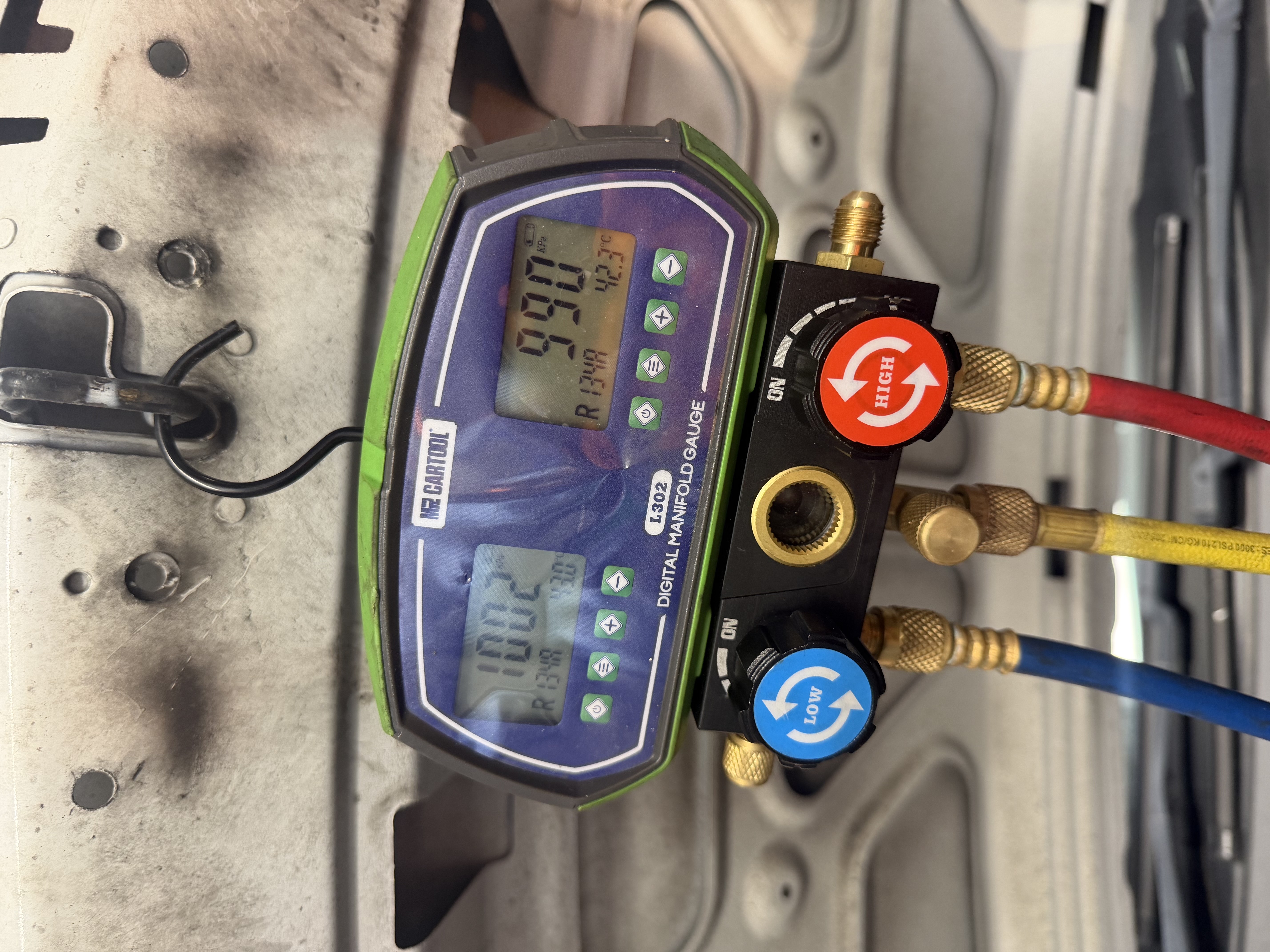 AC manifold gauges in use during air conditioning service at Shaw&rsquo;s Service Station