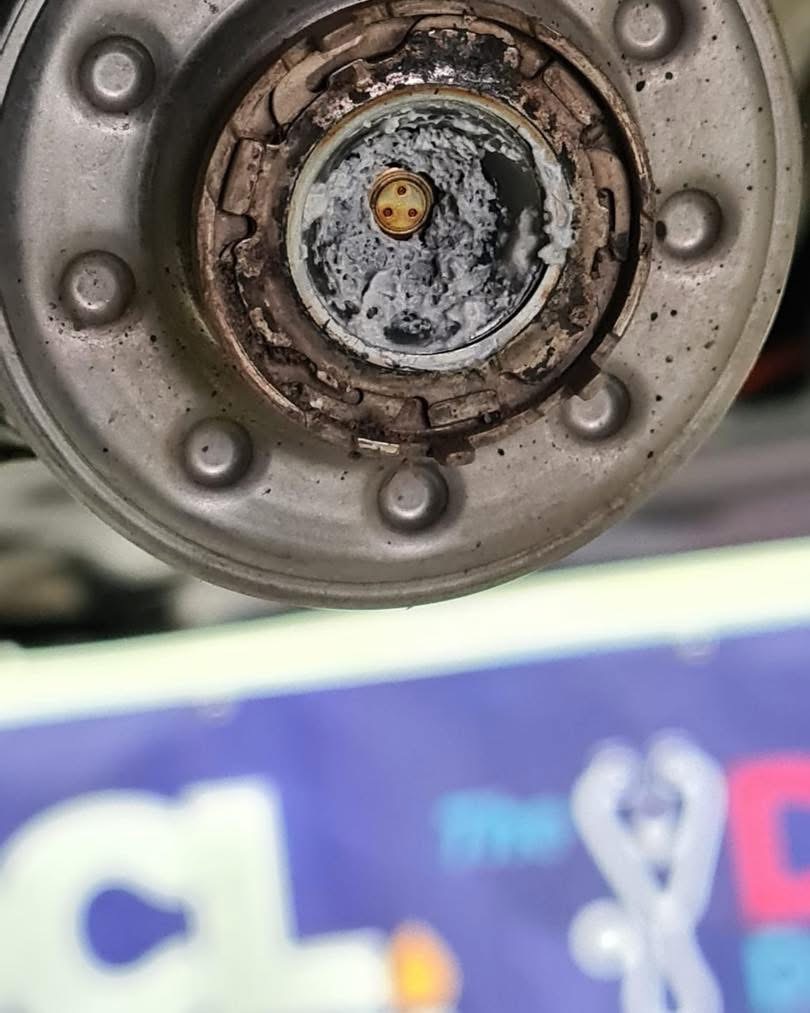 Glow plug tip with heavy corrosion and residue at Shaw’s Service Station