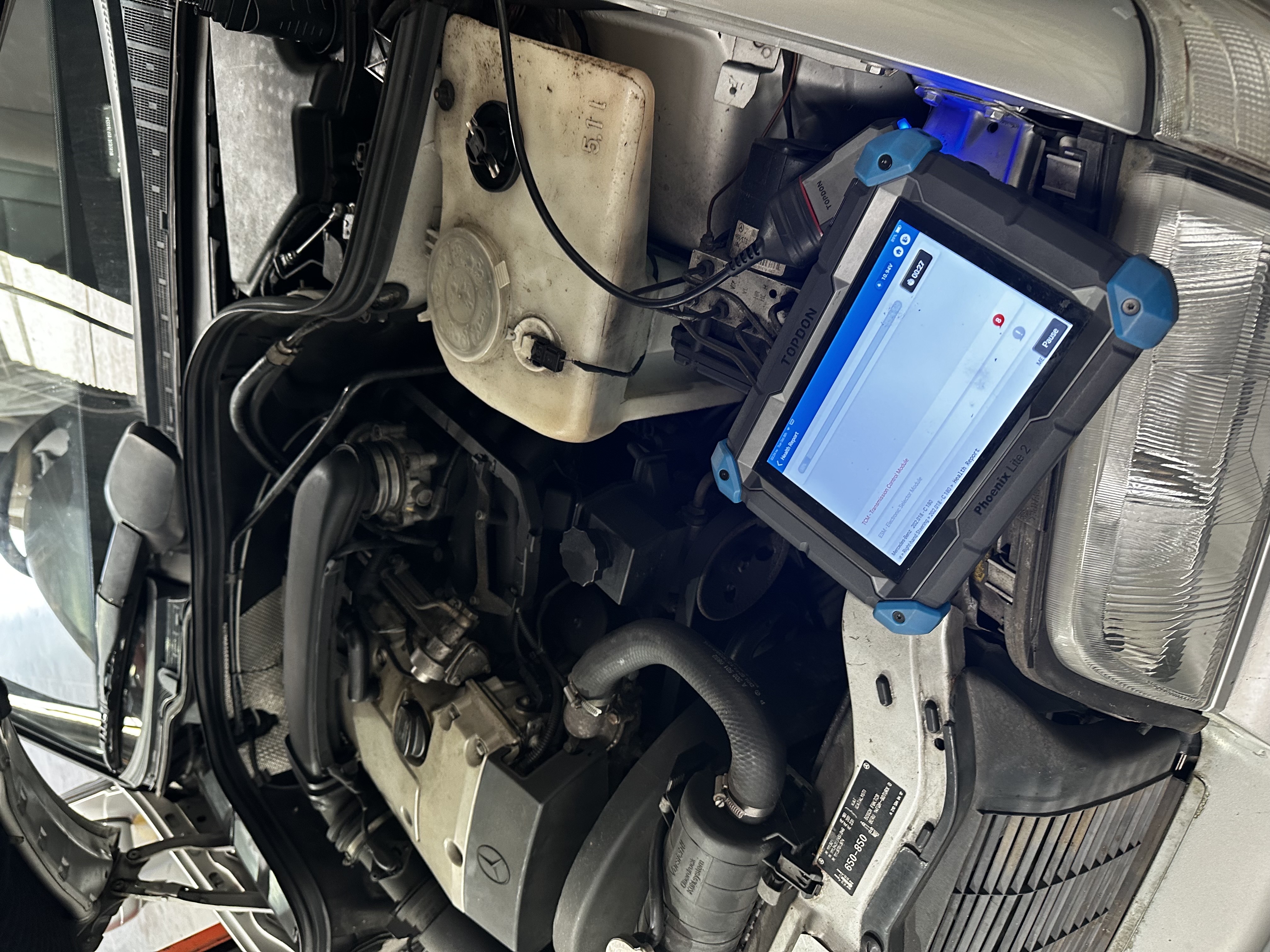 TOPDON Phoenix diagnostic health check scan on a vehicle at Shaw's Service Station