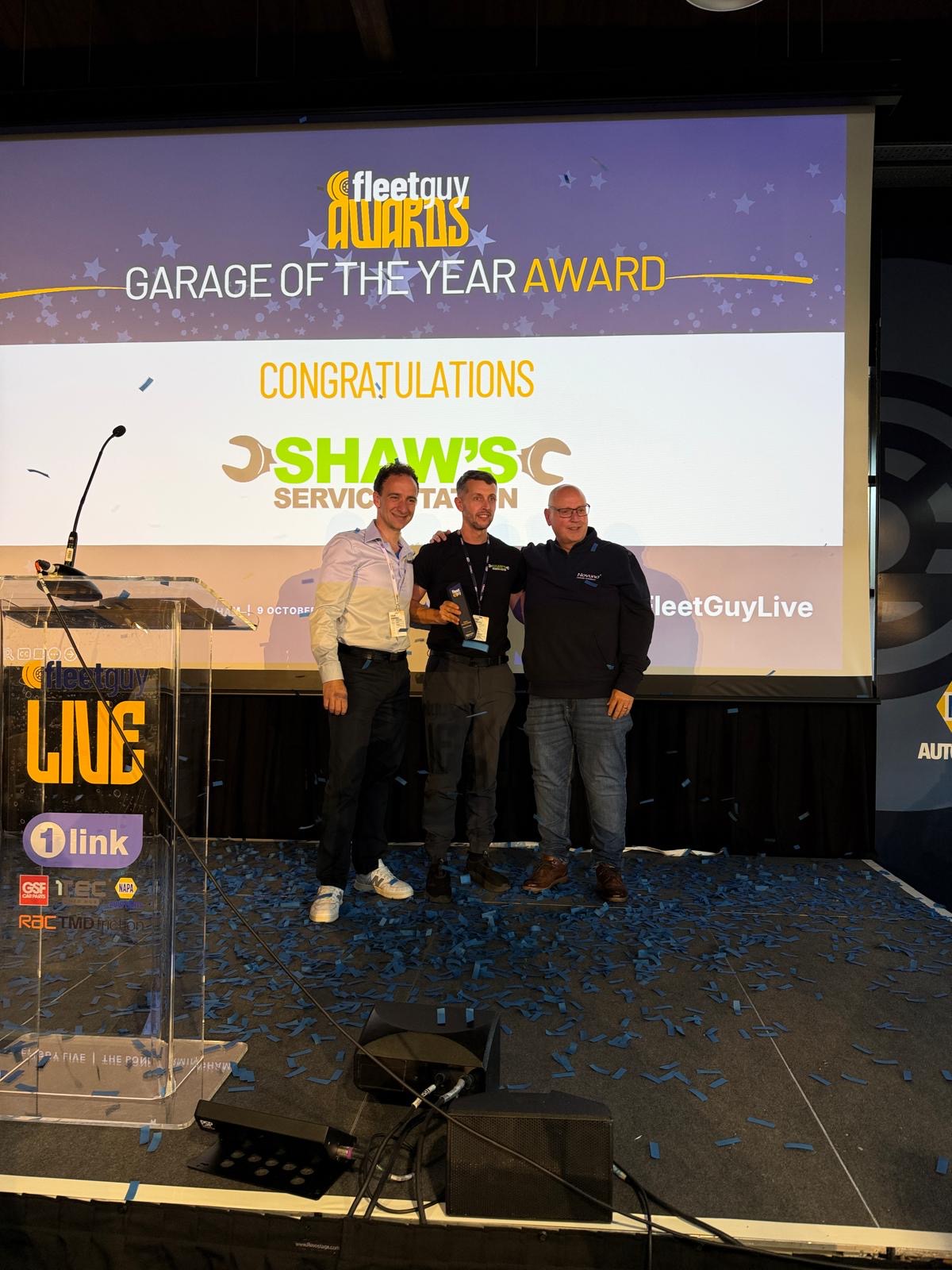 Rich Shaw collecting the Garage of the Year award on stage at the inaugural Fleet Guy Awards, Birmingham