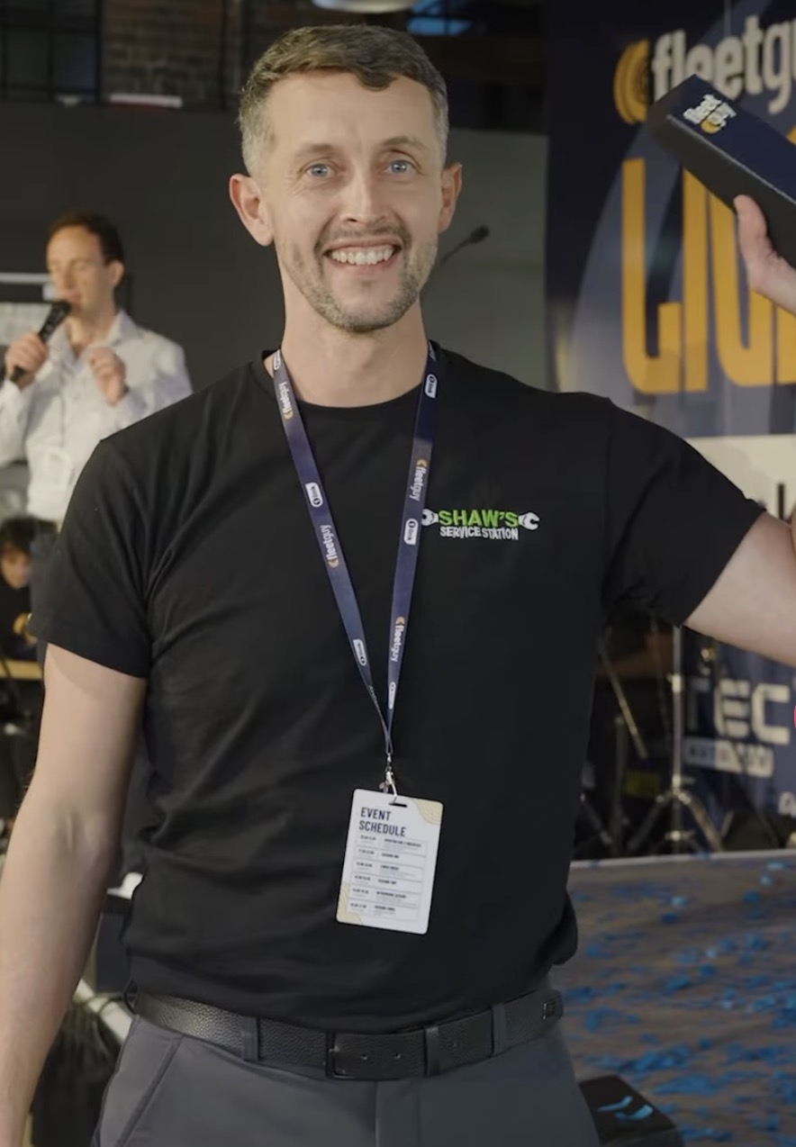 Rich Shaw holding the Fleet Guy Garage of the Year award at Fleet Guy LIVE Birmingham 2026