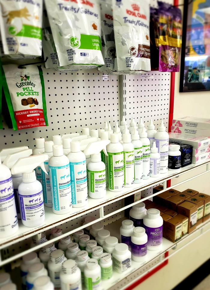 Pet treats and care products on the shelves at TAGS