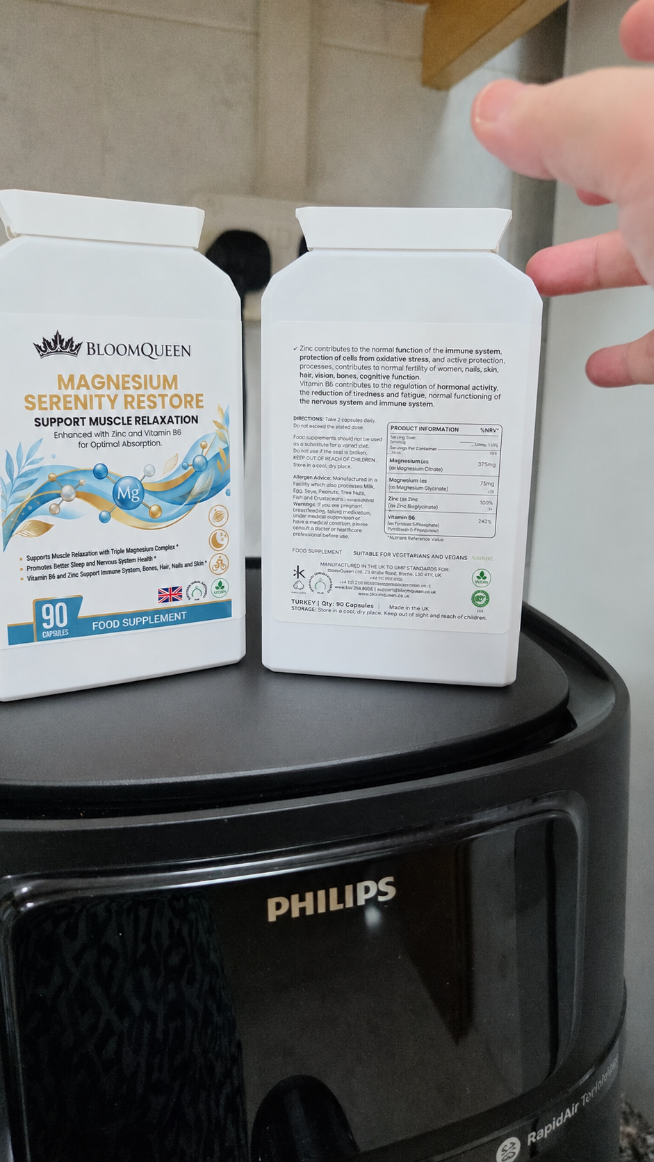 Two bottles of BloomQueen Magnesium on a kitchen counter