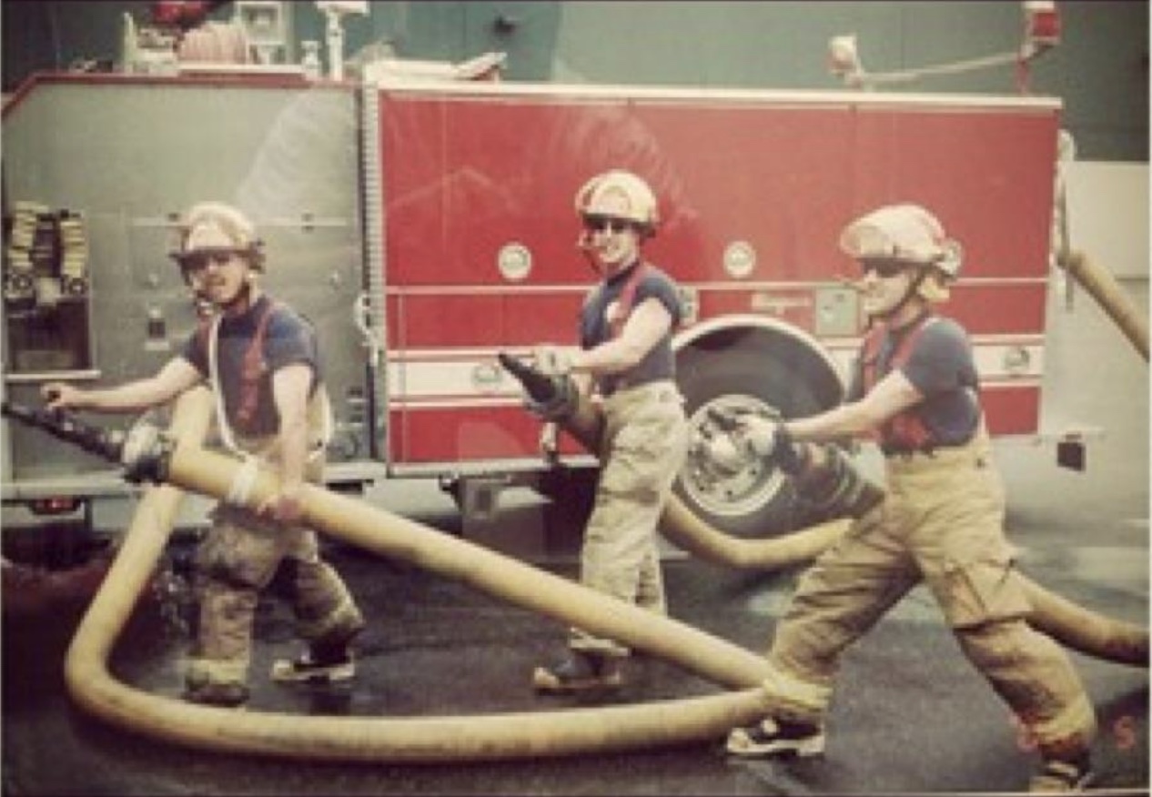 Trevor Dunbar with his oldest children as he was leaving the fire department