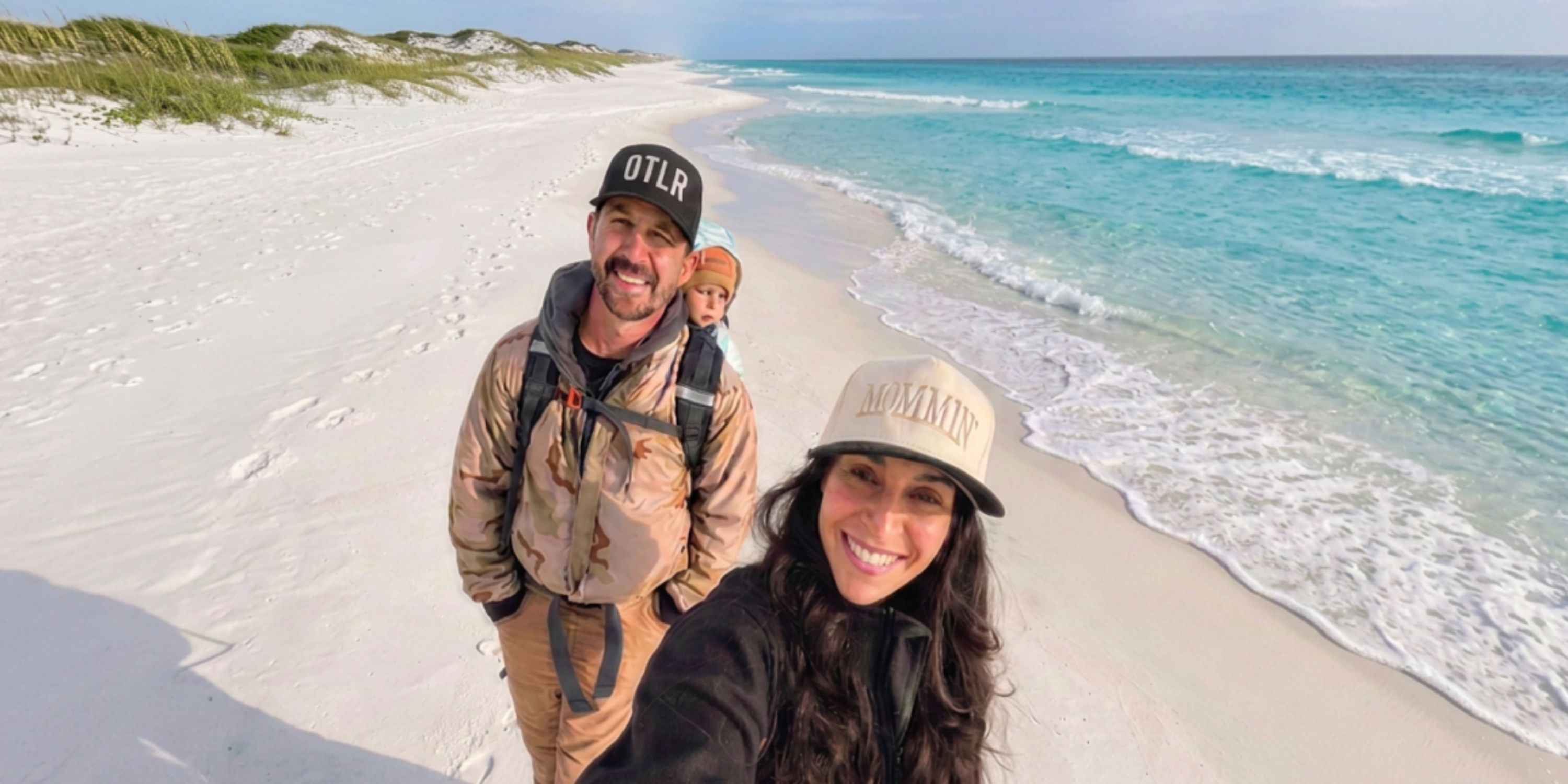 Trevor and Bridgett Dunbar with Maverick on the beach